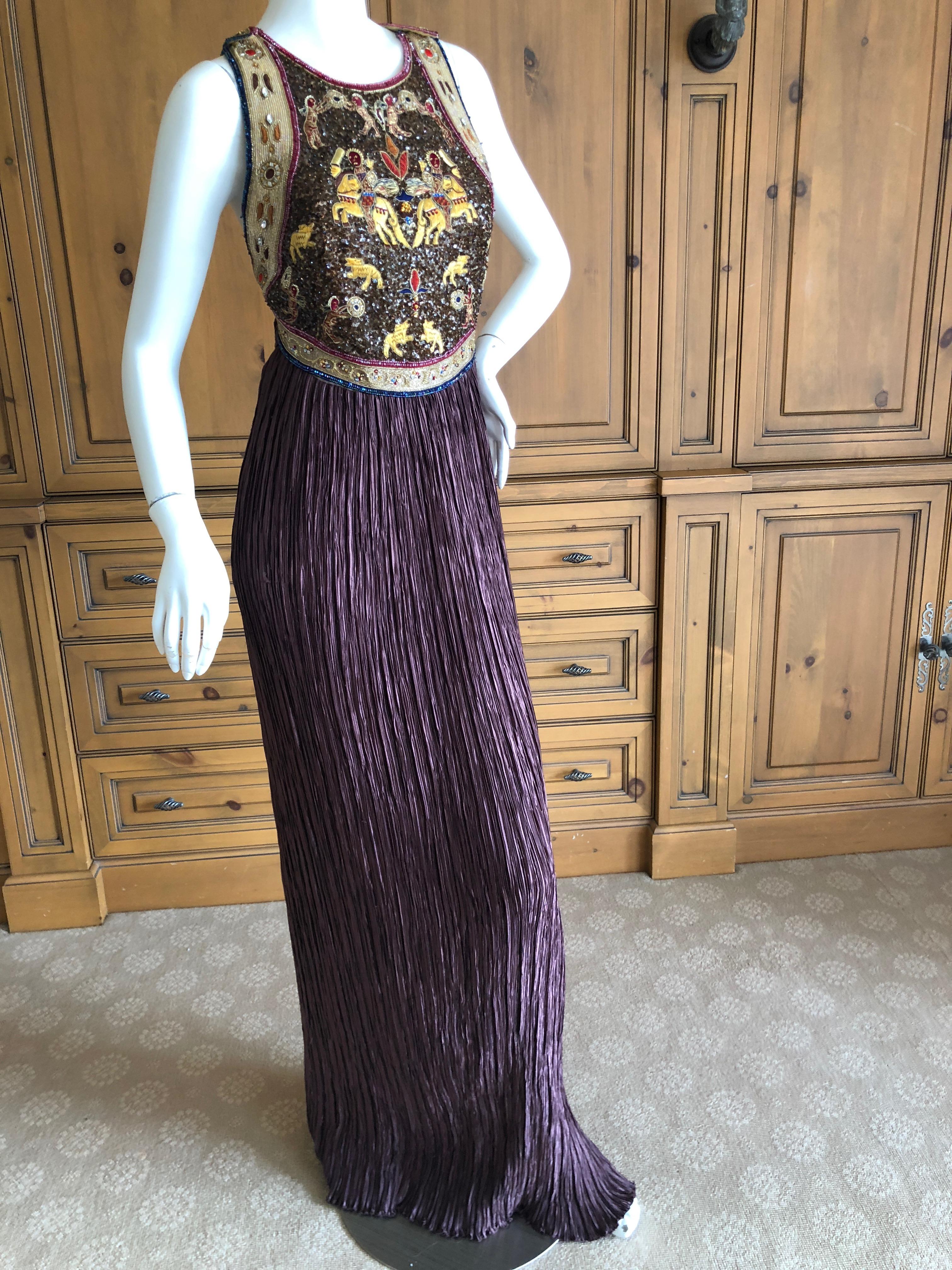 Mary McFadden Couture for Neiman Marcus Plisse Pleated Sleeveless Evening Dress with Folkloric Embroidery.
Please use the zoom feature to see the details.
Size 6
Bust 38