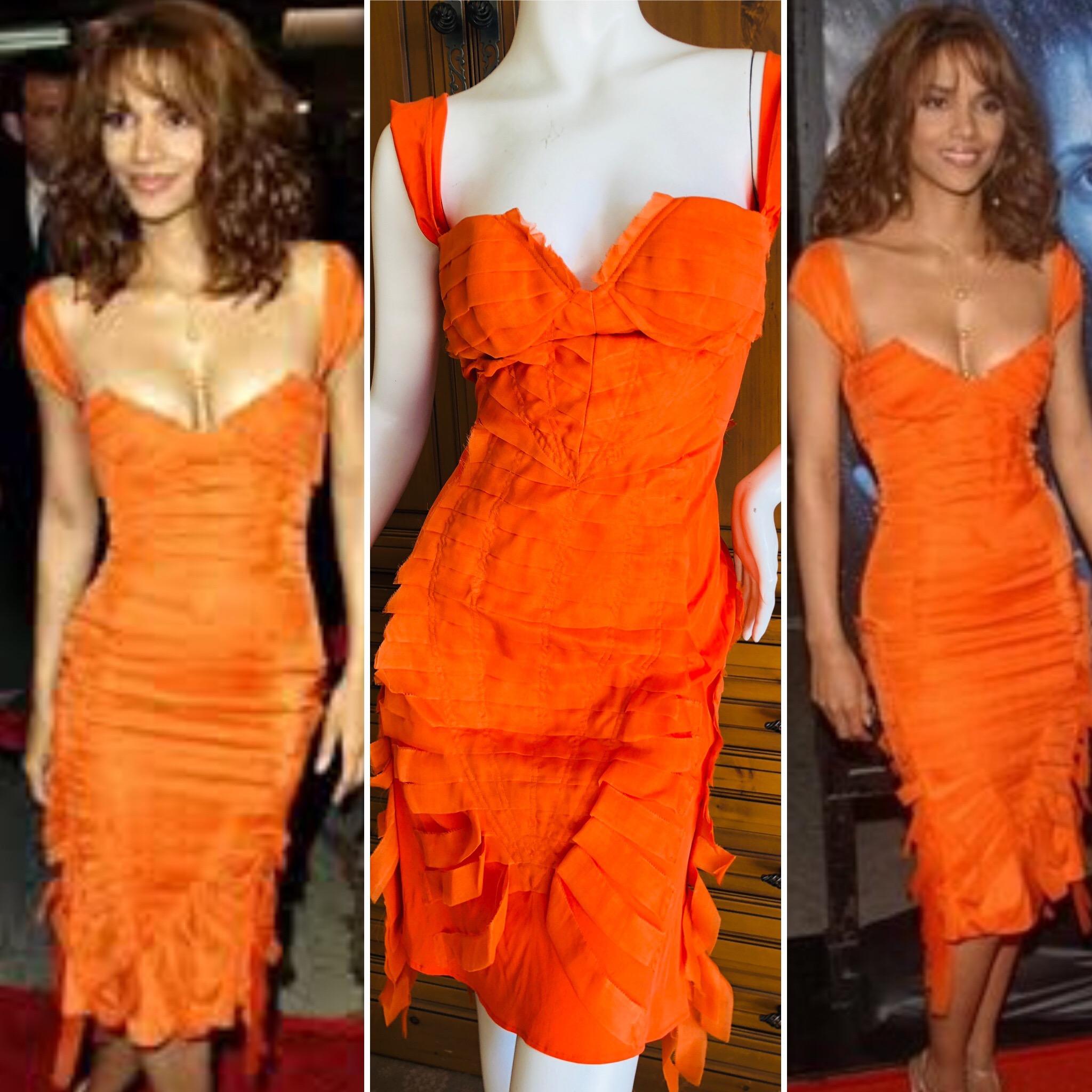 Gucci by Tom Ford  orange ribbon dress 2004 .
Appears in Tom Ford book twice, in orange/red.
This is classic Tom Ford, sexy coming and going. 
Size 44
 Bust 34