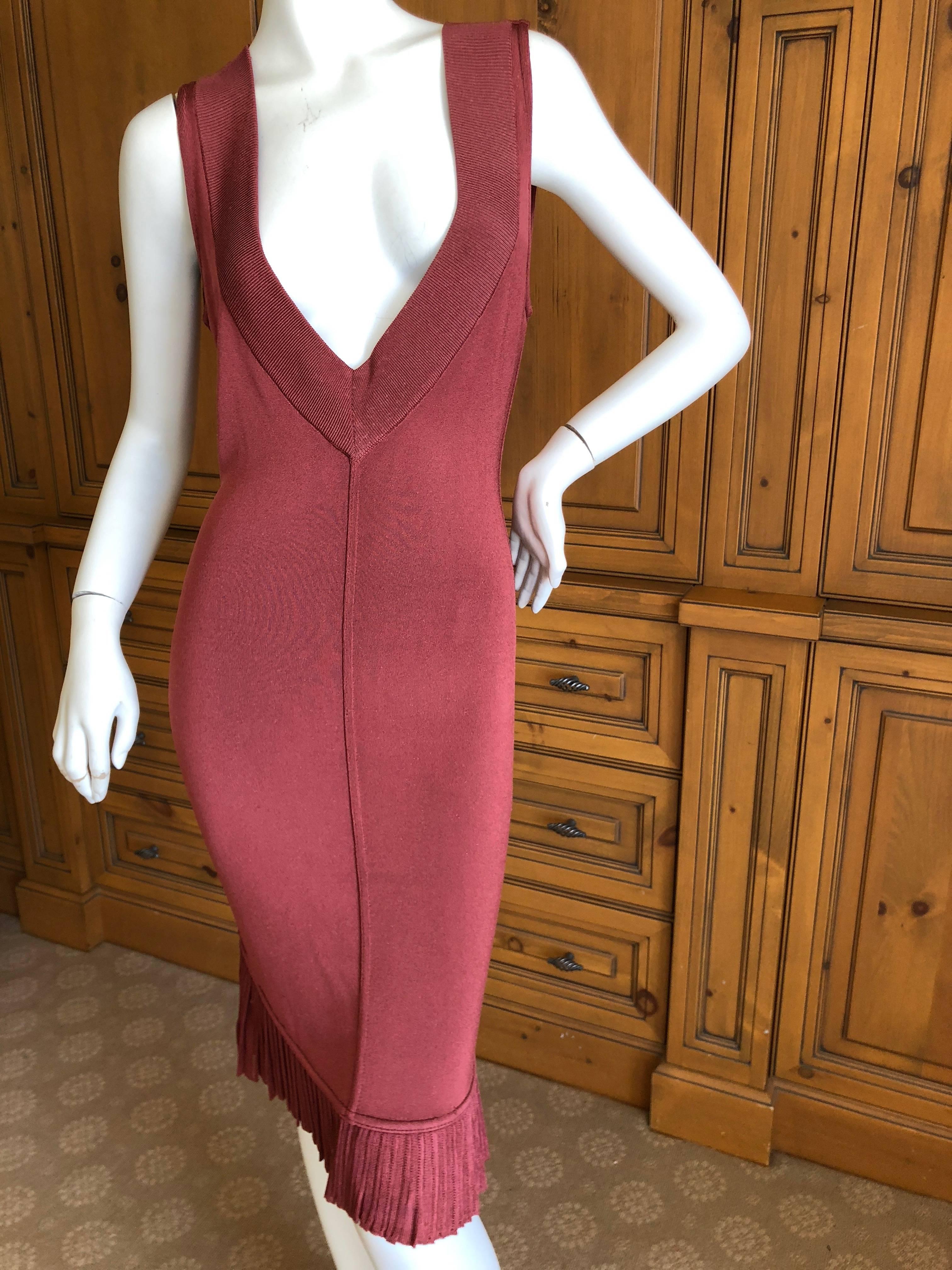 Azzedine Alaia Vintage  Supersexy Low Cut Coral Dress with Fishtail Back 
  There is  a lot of stretch, measured lying flat.
There are two Alaia's from this collector, both purchased in the eighties and never worn.
Please see all the great 80's