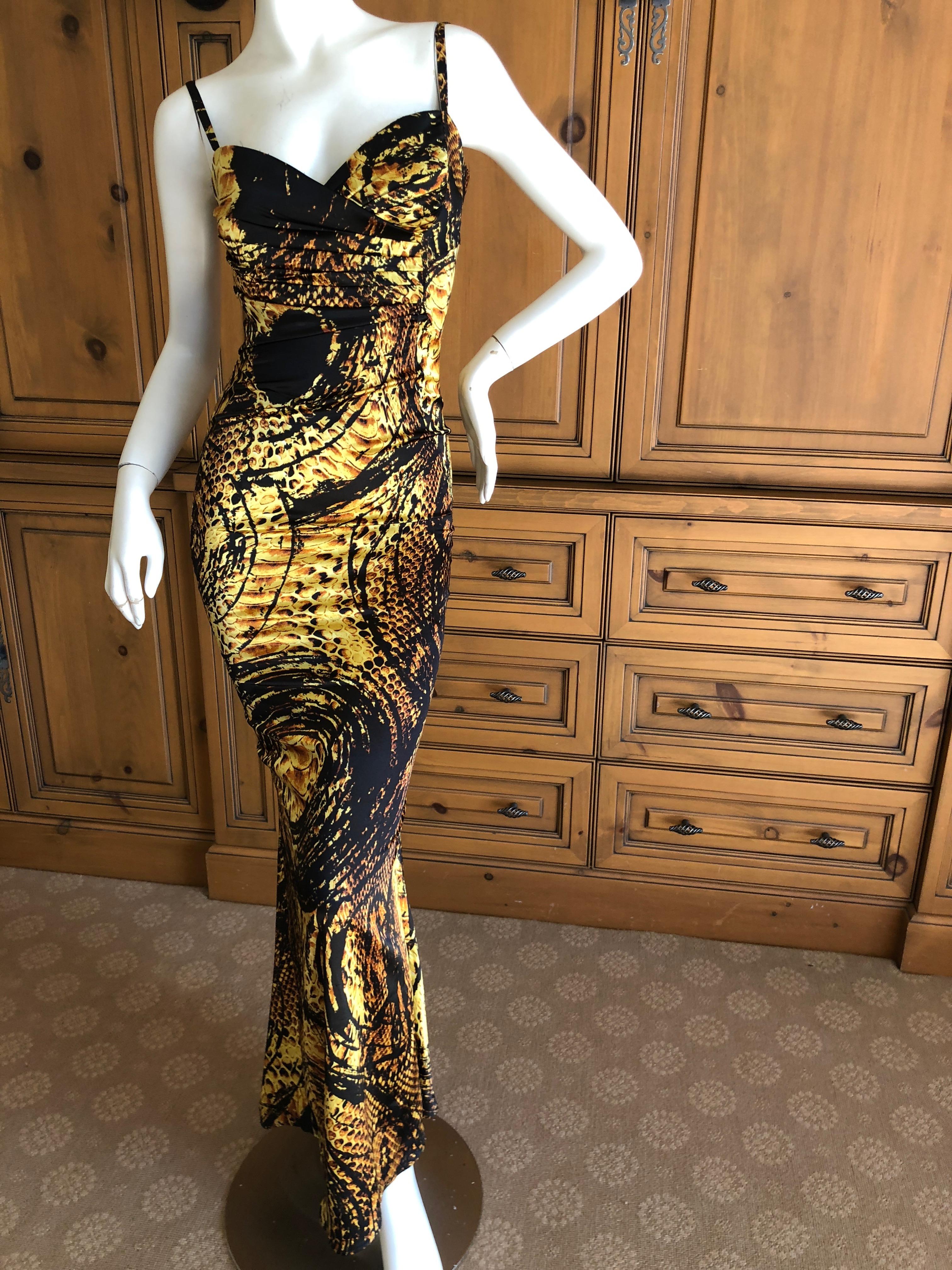 Roberto Cavalli Elegant Reptile printEvening Dress.
This is so pretty, with a rich gold on black print
Size 38, but runs small.
Bust 36