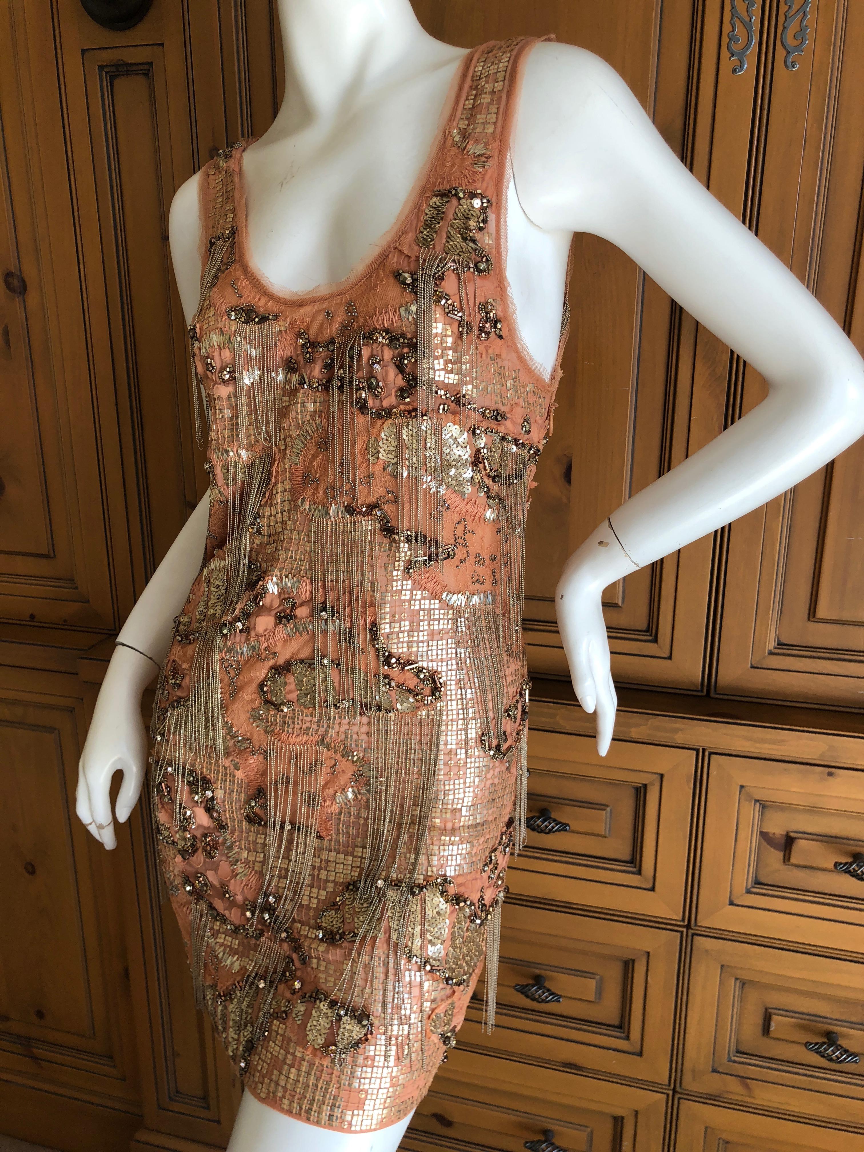 Roberto Cavalli Heavily Embellished Flapper Style Mini Dress.
This is astonishing, with metal chain and beads on net.
There is no size tag, I estimate it is a size small.
Bust 33