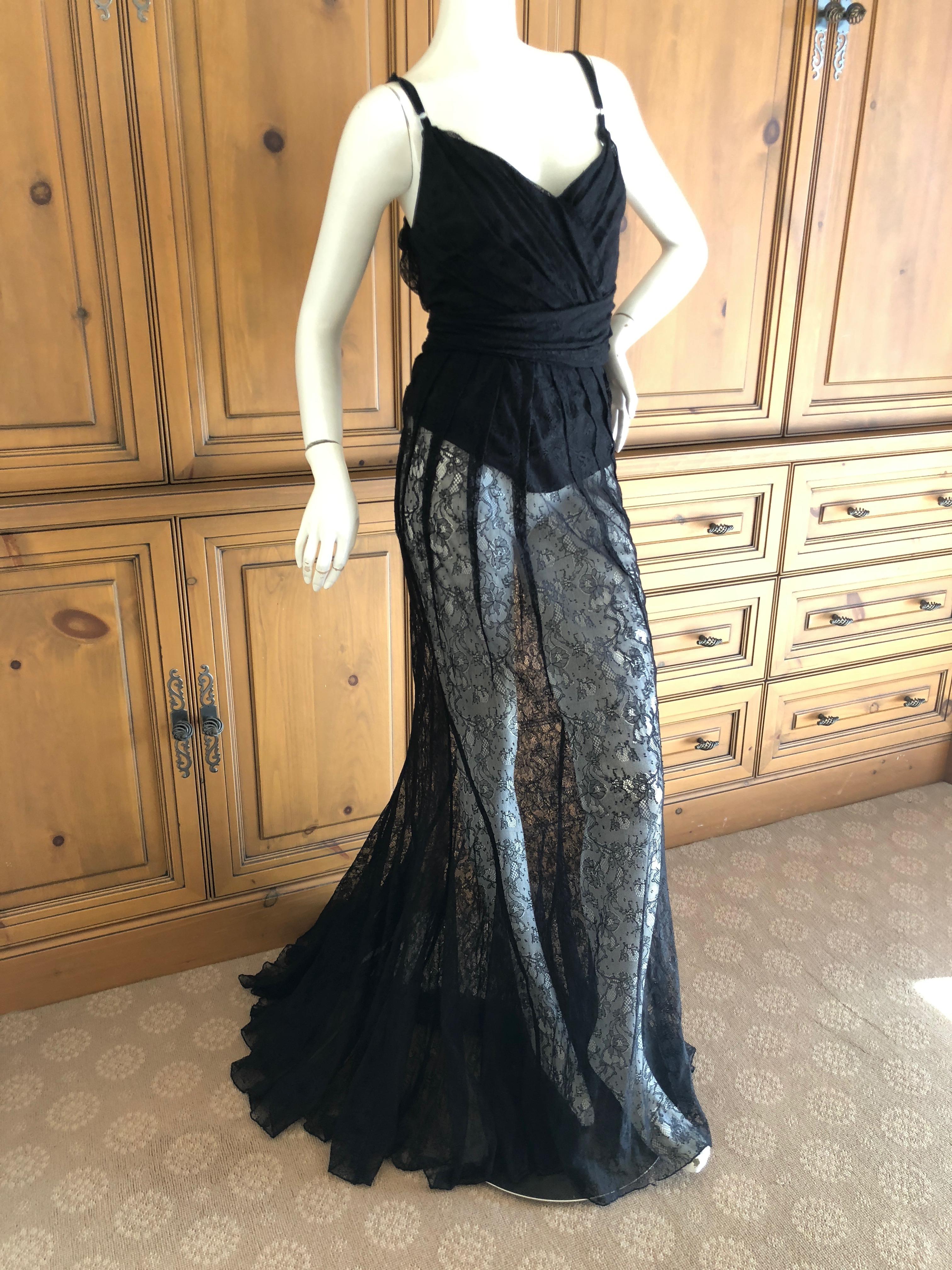 D&G Dolce & Gabbana Sheer Black Lace Vintage Evening Dress with Train.
It is fully lined, but I also show it with the lace exposed by pulling it up.
Size 44
Bust 39