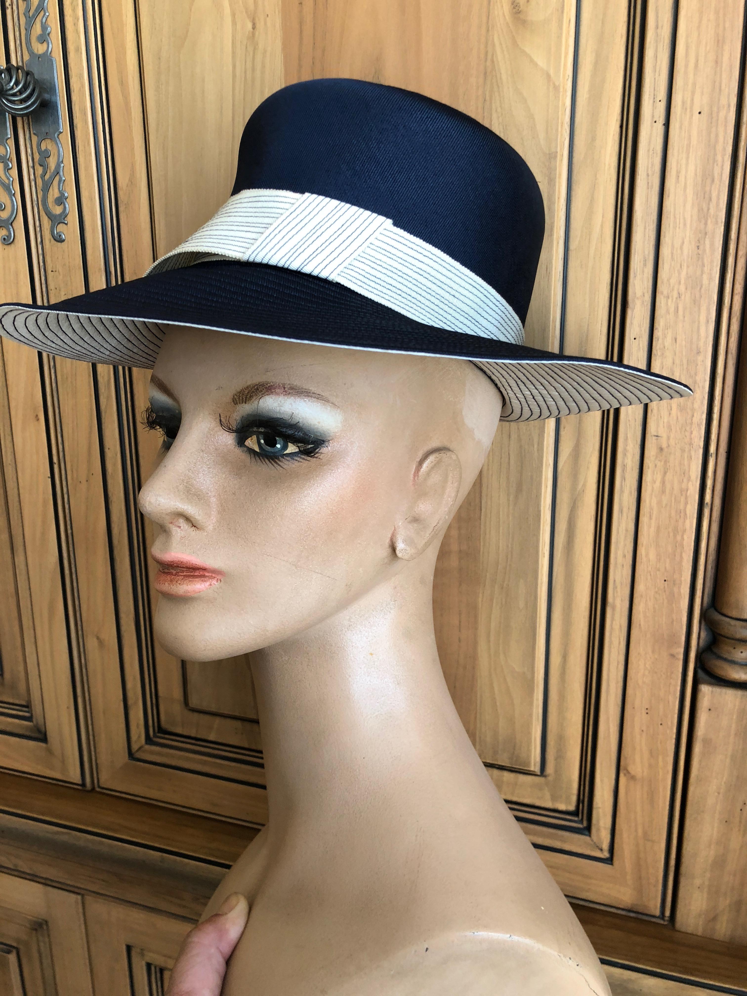 Lilly Daché for I. Magnin 1960 Deadstock Navy and Cream Fedora Hat
22.5 inch circumfrence