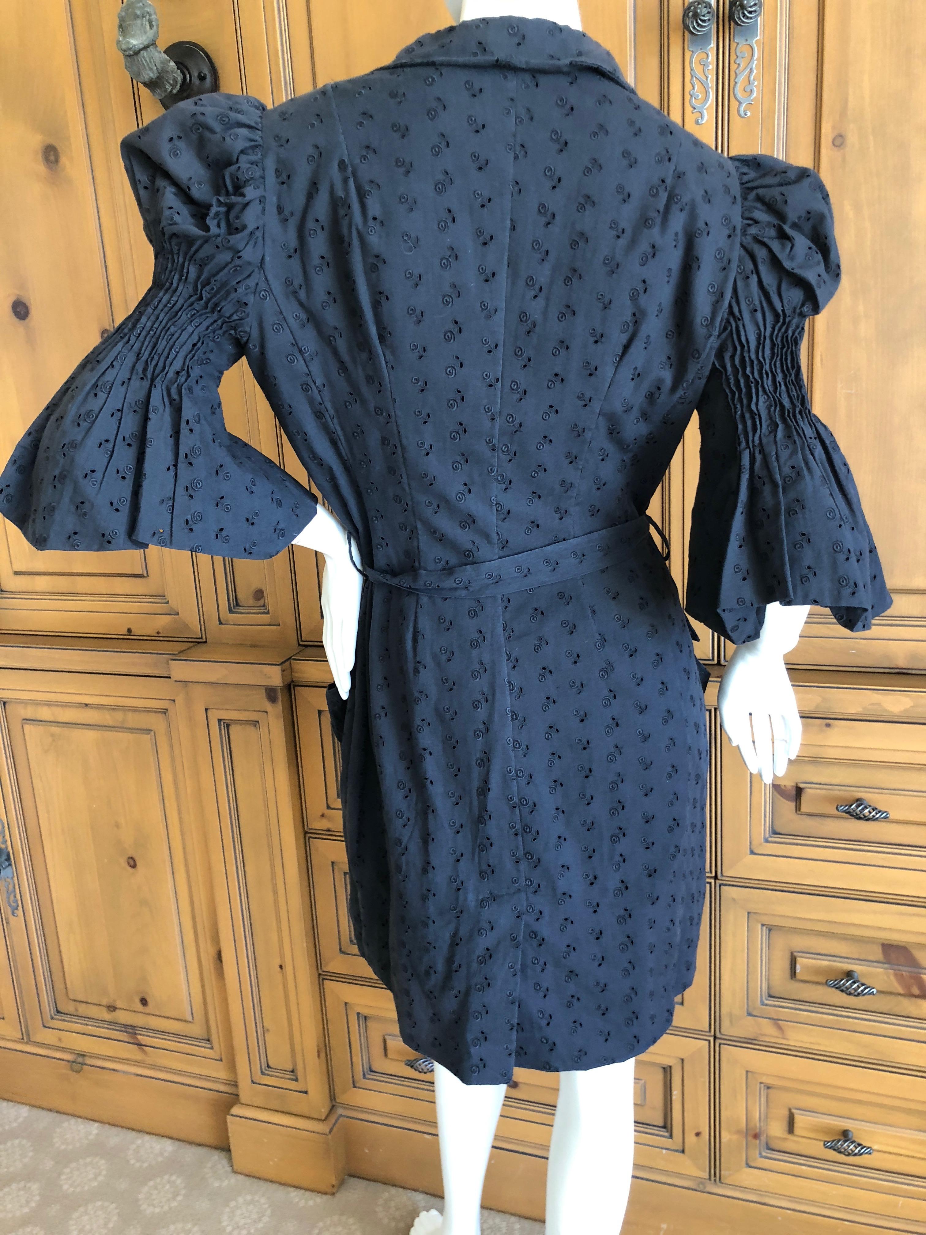  John Galliano 1998 Black Belted Cotton Eyelet Dress with Leg of Mutton Sleeves.
So much prettier in person. Please use zoom feature to see details.
Sz 42
Bust 40