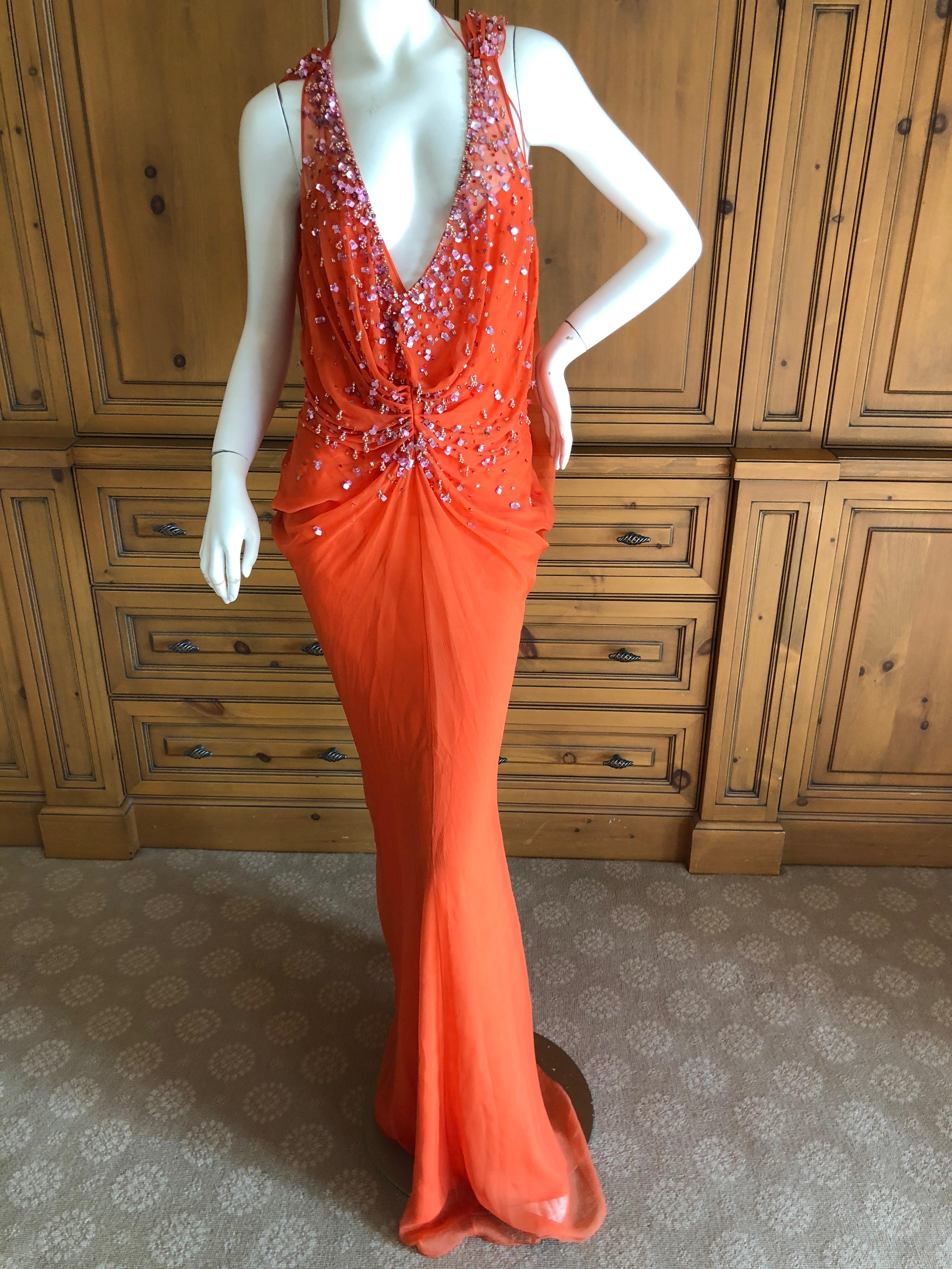 Christian Dior by John Galliano Low Cut Embellished Orange Silk Evening Dress.
This is so pretty, please use the zoom to see the details.
Size 38
 Bust 36