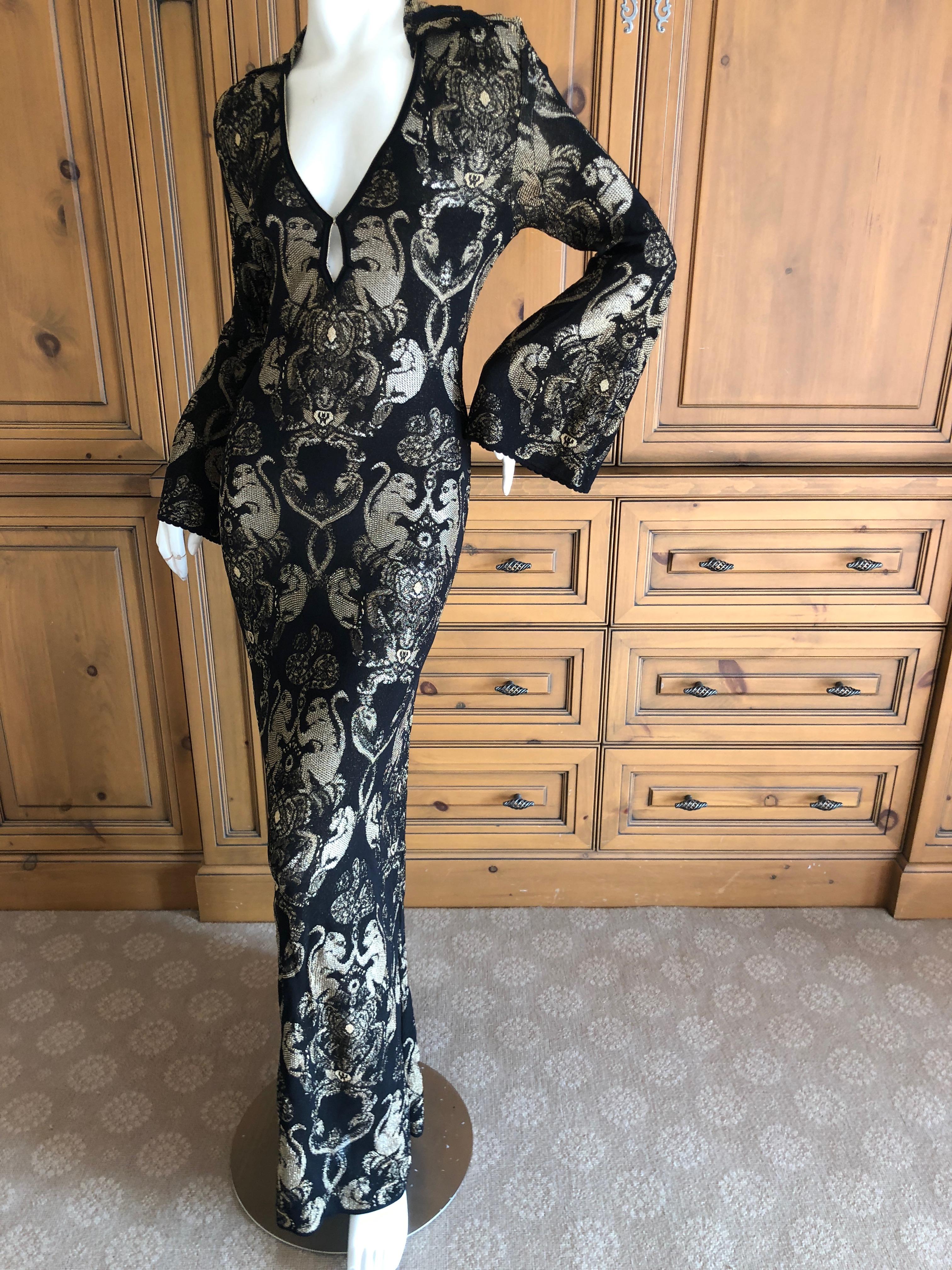 Roberto Cavalli Vintage Golden Monkey Pattern Low Cut Keyhole Knit Evening Dress.
So unusual, the monkey pattern is in gold thread on a rich brown .
There is a lot of stretch in this knit fabric.
Size 44
Bust 36