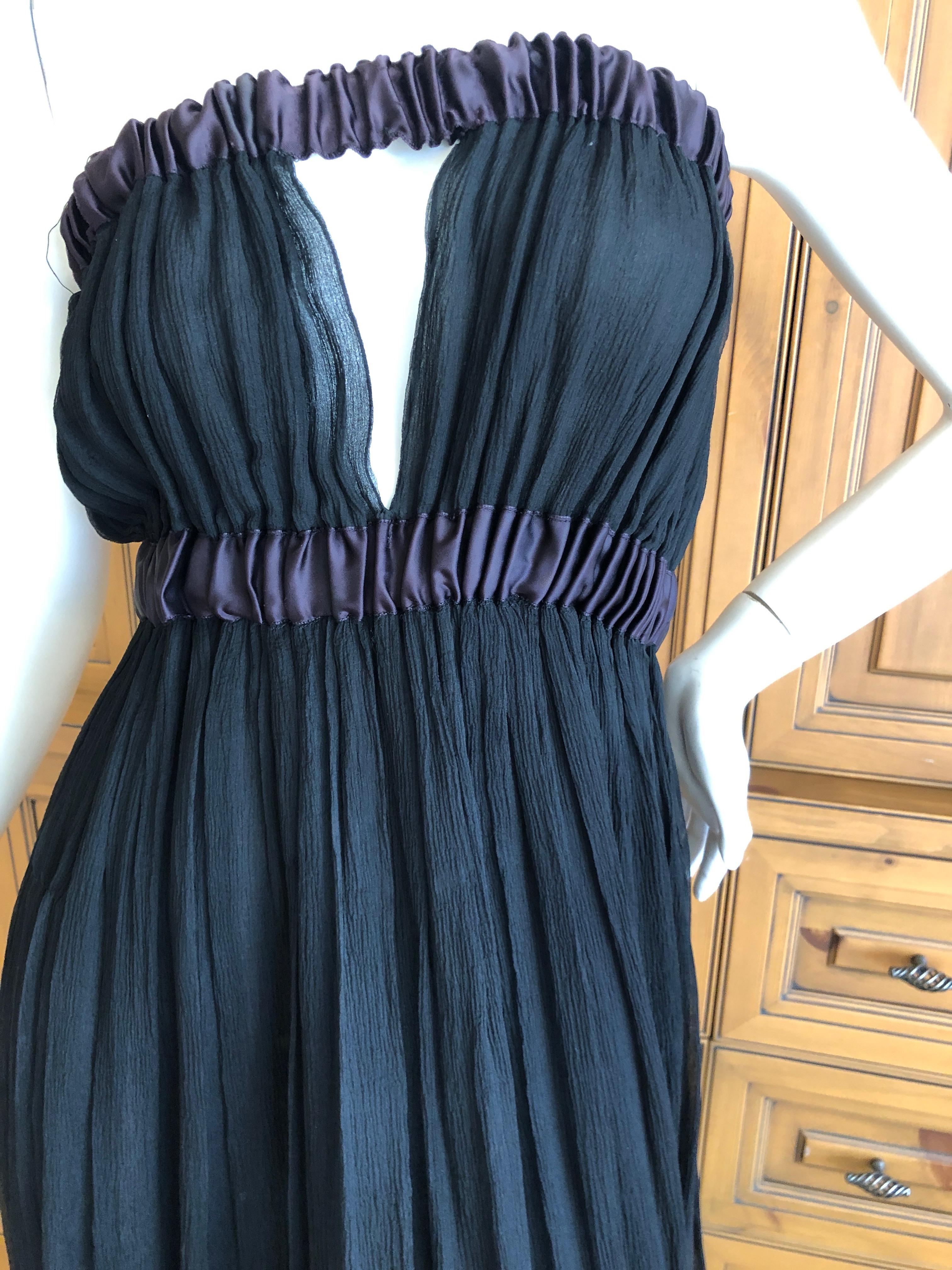 Yves Saint Laurent Rive Gauche Black Pleated Strapless Keyhole Dress .
So delightfully French.  Elasticized bust and waist.
Size 38
Bust 36