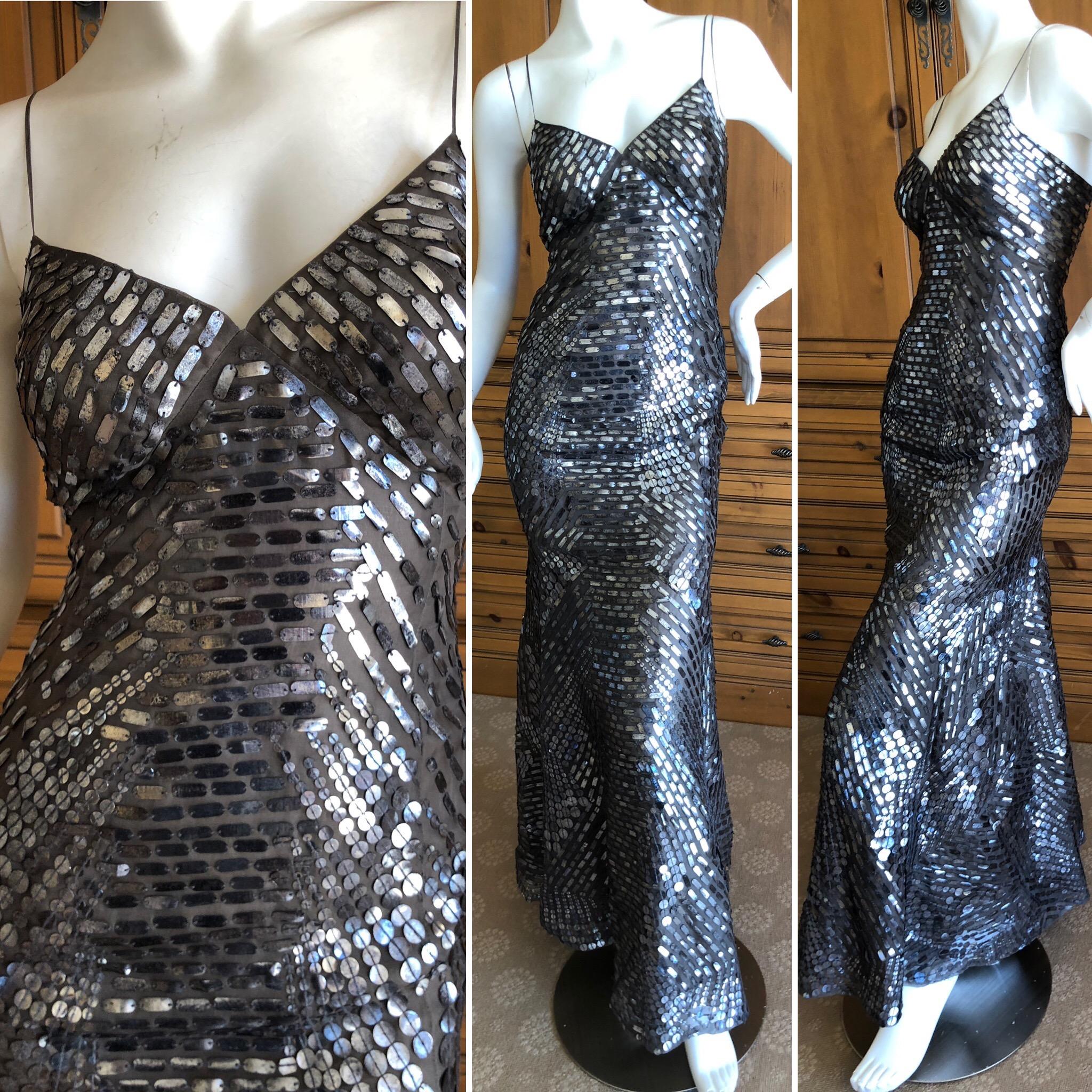 Oscar de la Renta Pewter Mosaic Pattern Sequin Mermaid Gown
This is hard to photograph, but is covered in a geometric pattern of pewter sequin that shimmers in the light.
Size 4
Bust 34