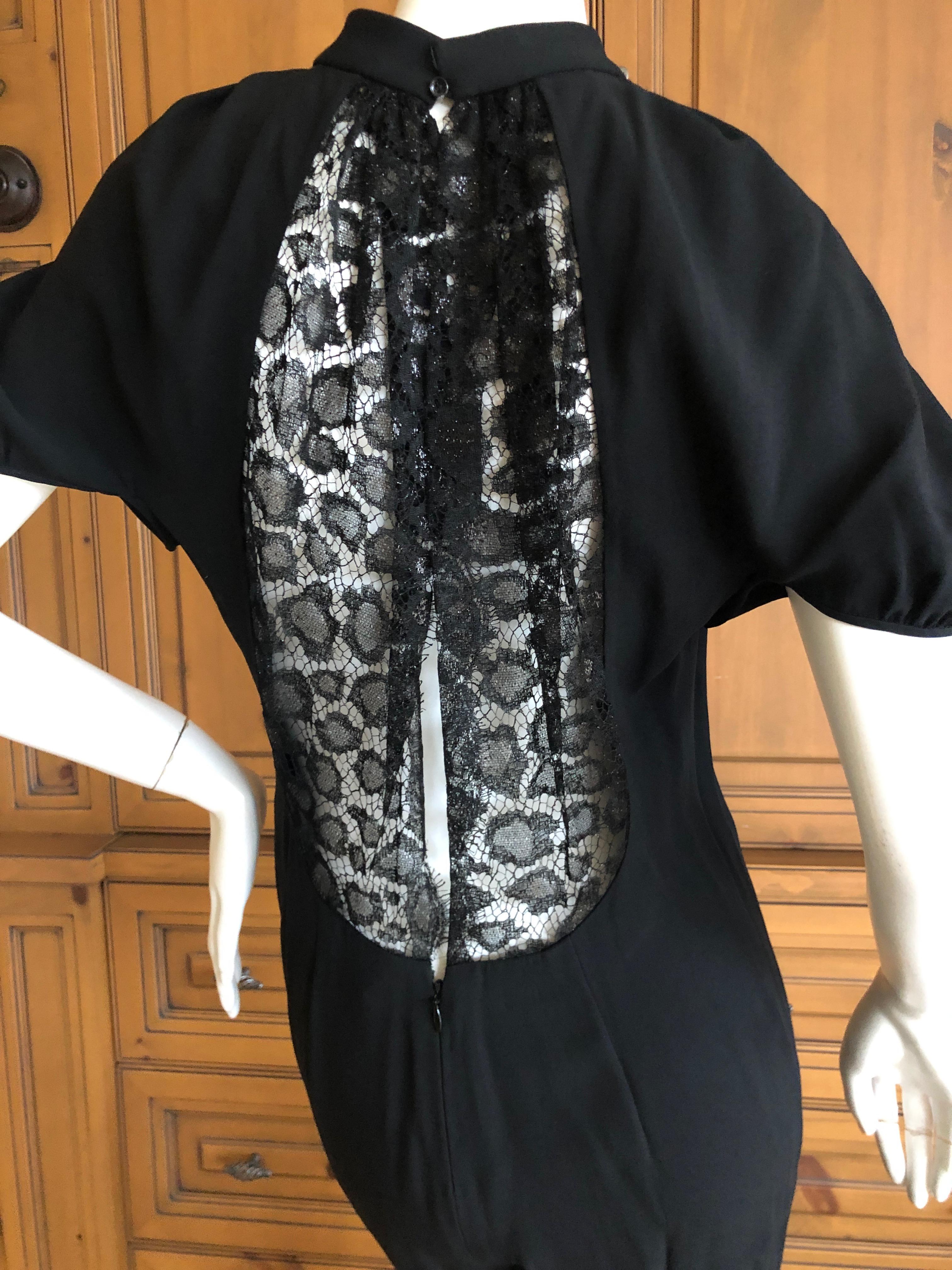 Yves Saint Laurent by Tom Ford Black Jumpsuit with Sheer Black Lace Back.
The pants are pencil thin.
Size 38 French
Bust 36