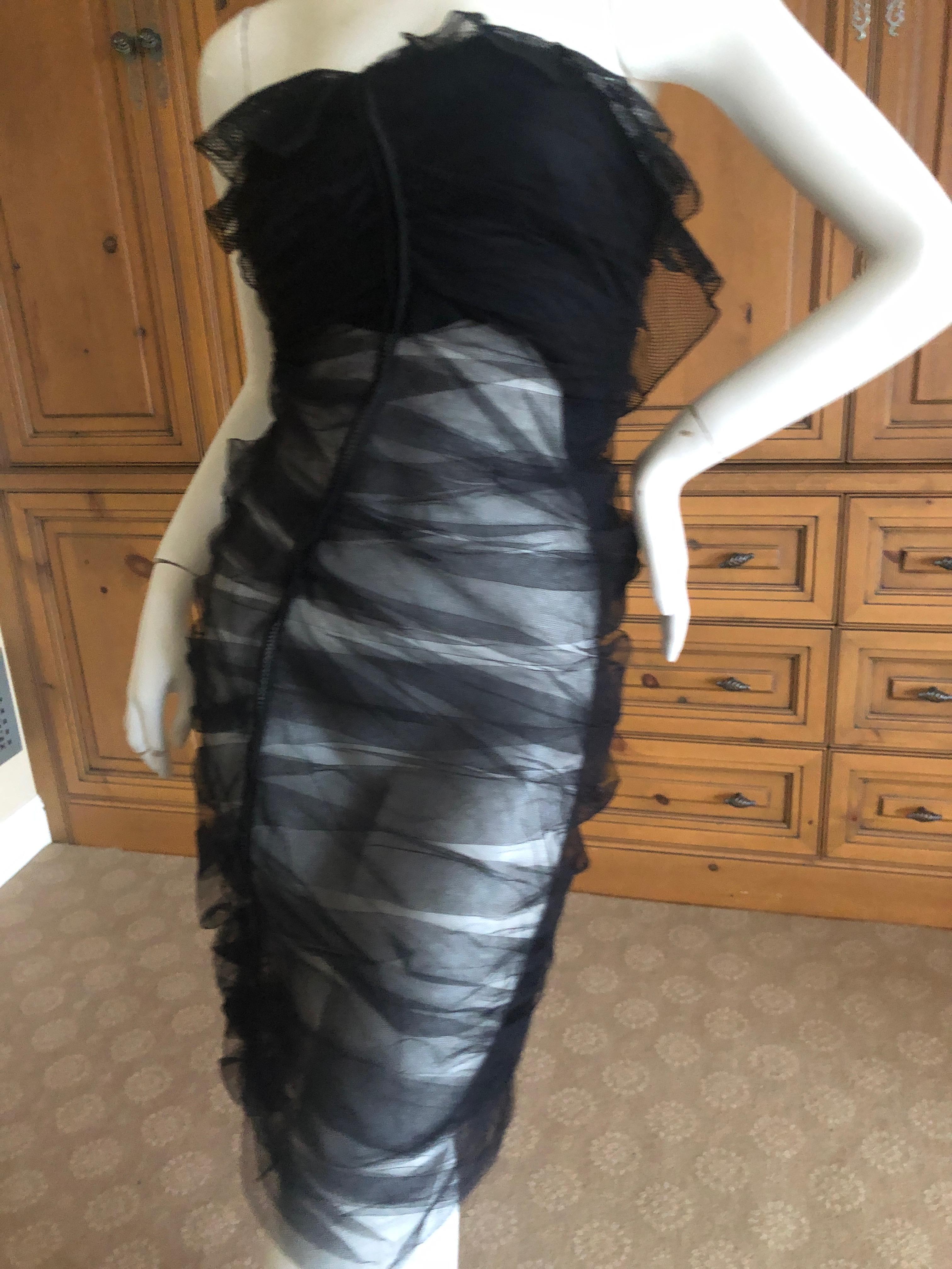 Yves Saint Laurent by Tom Ford  Ruched Black Tulle Cocktail Dress.
I show it with the lining raised to see details, and how it would look removed.
French Size 38
Bust 34