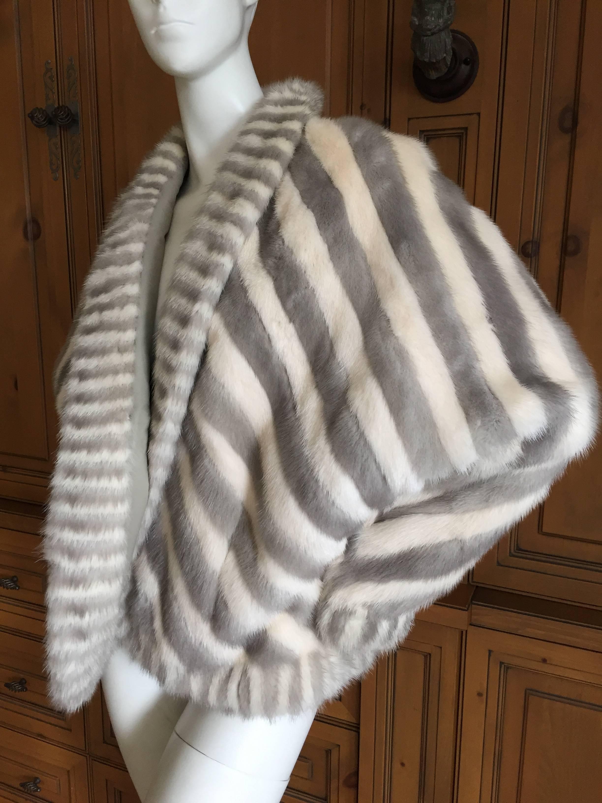 Wonderful ivory and gray stripe reversible mink cocoon jacket.
So chic, and so warm.
Reverses to gray leather
