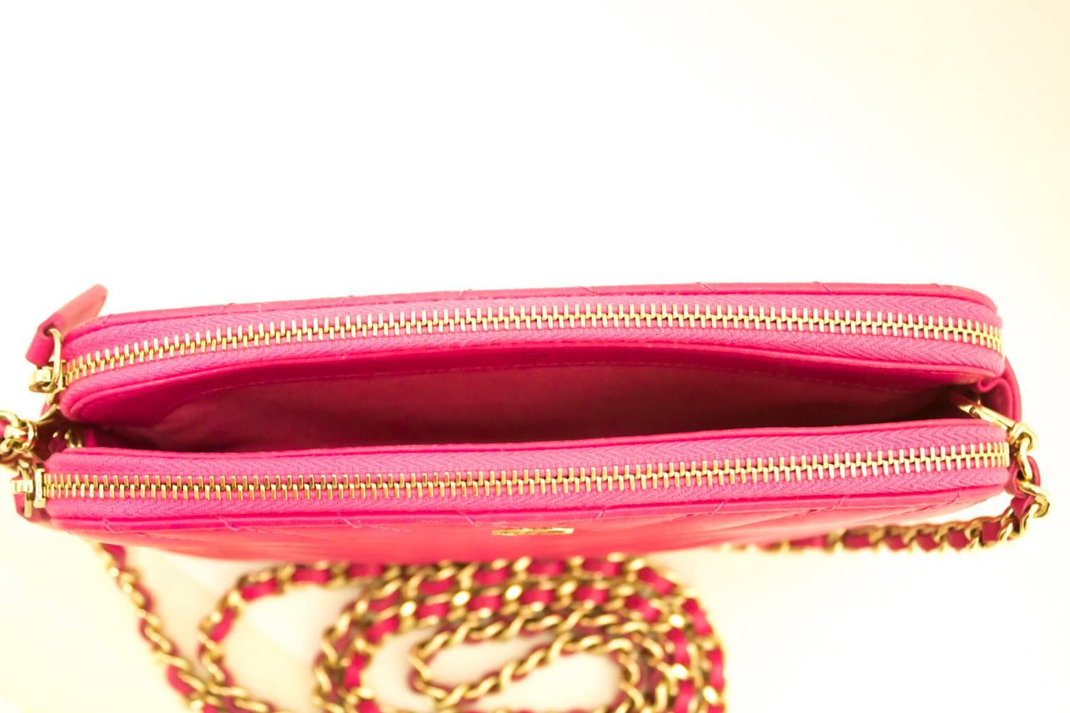 An authentic CHANEL Hot Pink Wallet On Chain WOC Double Zip Chain Shoulder Bag The outside material is made of black Lambskin.
Conditions & Ratings
Outside material: Lambskin
Color: Hot Pink
Closure: Zipper
Hardware and chain: Gold-tone
Made in