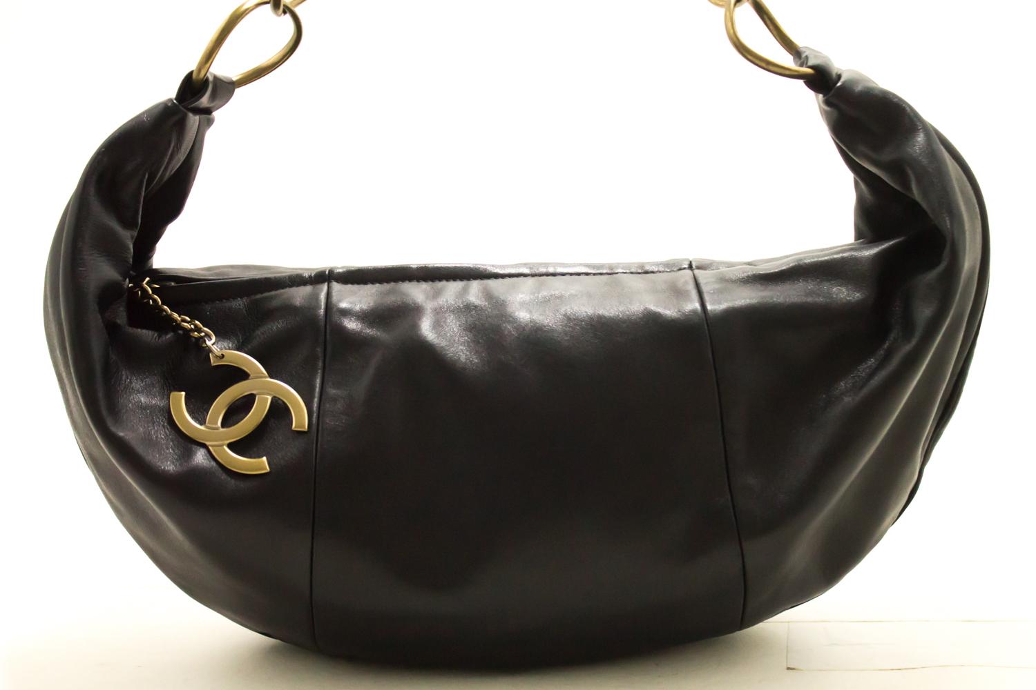 An authentic Chanel Half Moon made of black Lambskin Chain Shoulder Bag Black Leather Zipper. The color is Black. The outside material is Leather. The pattern is Solid.
Conditions & Ratings
Outside material: Lambskin
Color: Black
Closure: