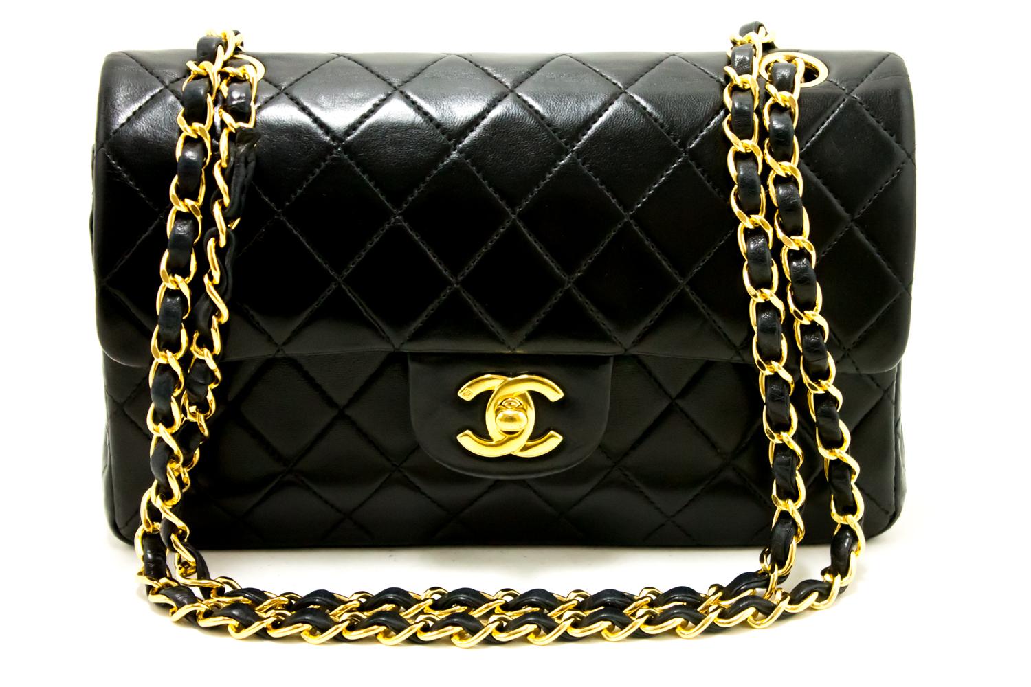 An authentic CHANEL 2.55 Classic Double Flap Small Chain Shoulder Bag Black Quilted. The color is Black. The outside material is Leather. The pattern is Solid.
Conditions & Ratings
Outside material: Lambskin
Color: Black
Closure: Turnlock
Hardware