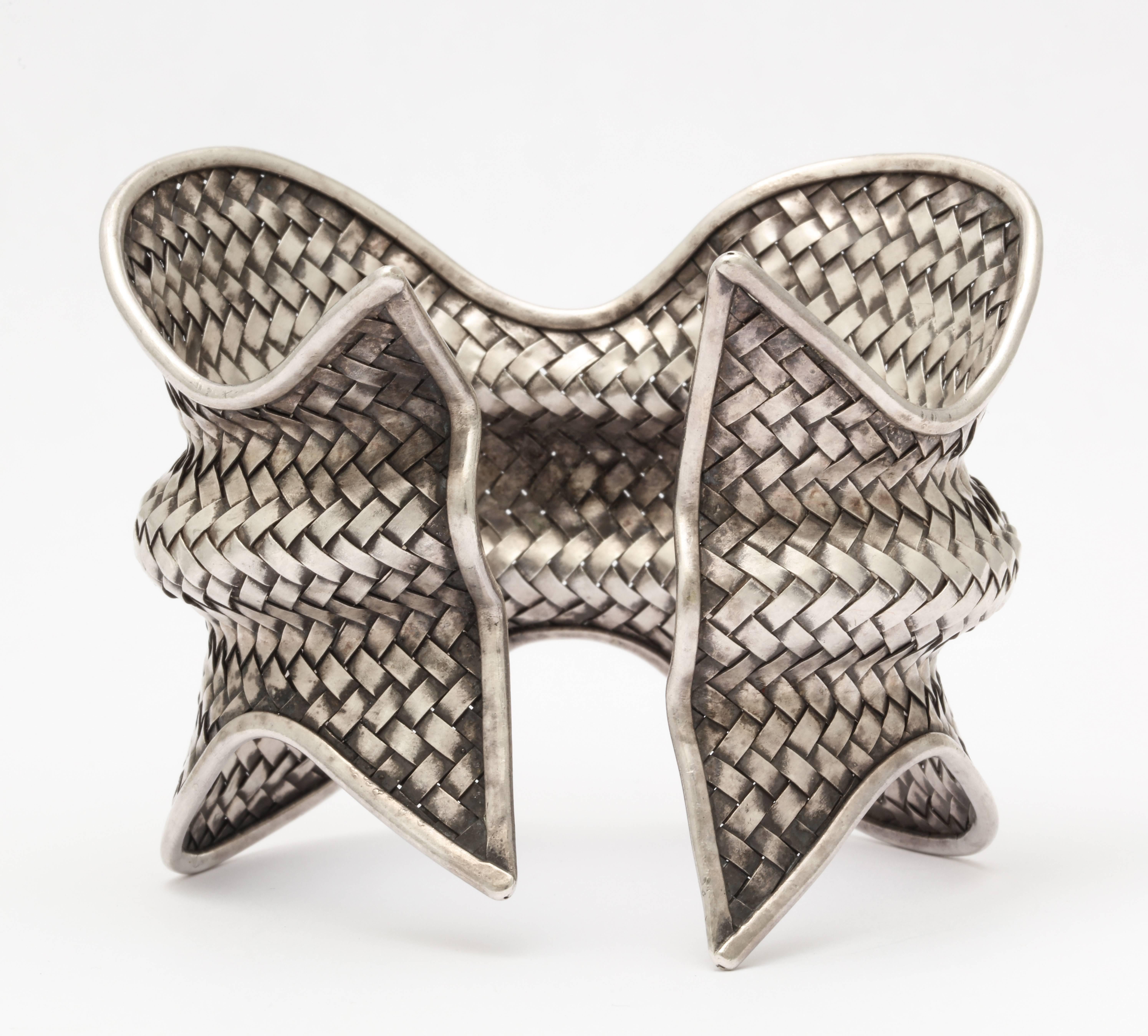 A fabulous designer woven modernist sterling silver cuff with great curves