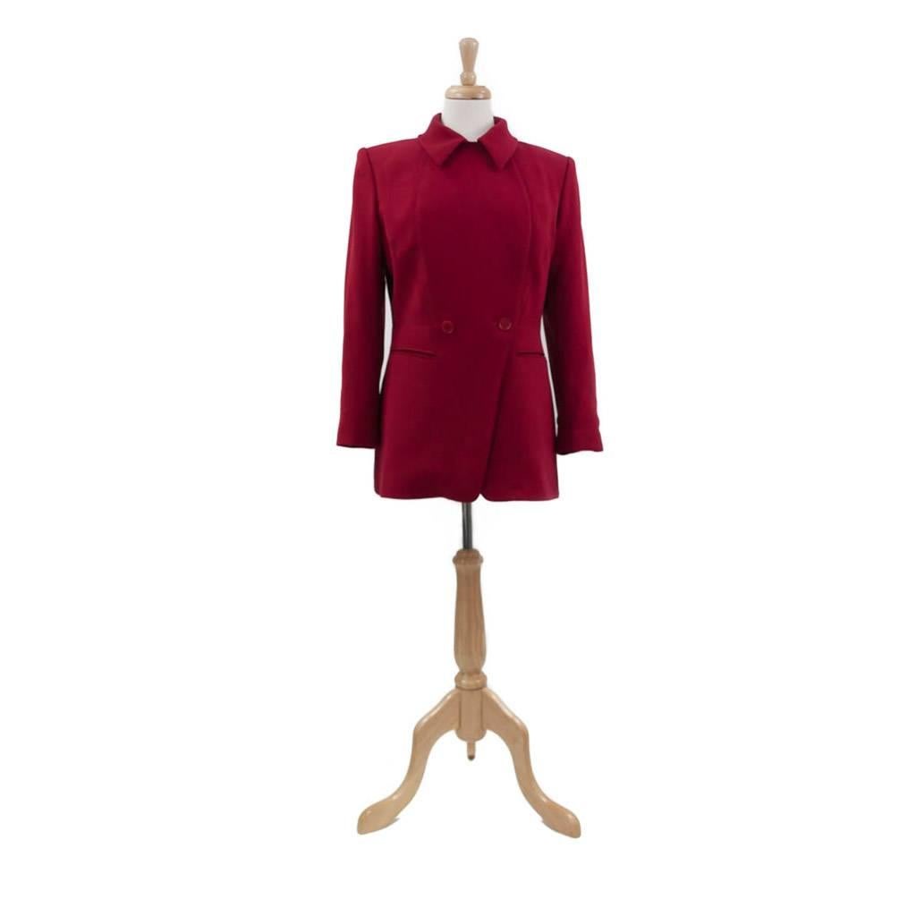 Classic Red Hermes Jacket, long sleeved, double breasted with cut away front, slit pockets at hip, top stitched inset at front with flattering curved detail. Back has centre panel, with triangular insets finishing at waist. Closed with a single row