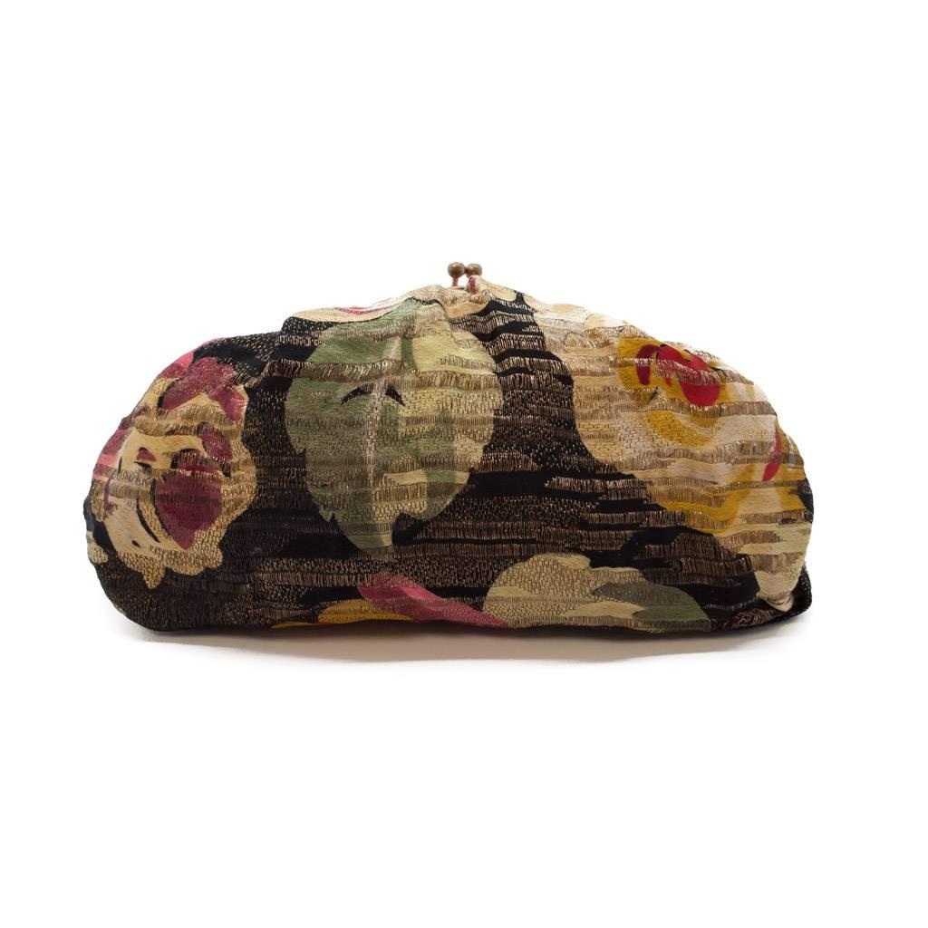 This is a really delightful little bag from the late 1920s. This bag was most probably made to match an evening jacket or cape. The very fine silk brocade ( which reminds us of a Bianchini Ferier design)  is rich in texture and it has a gorgeous