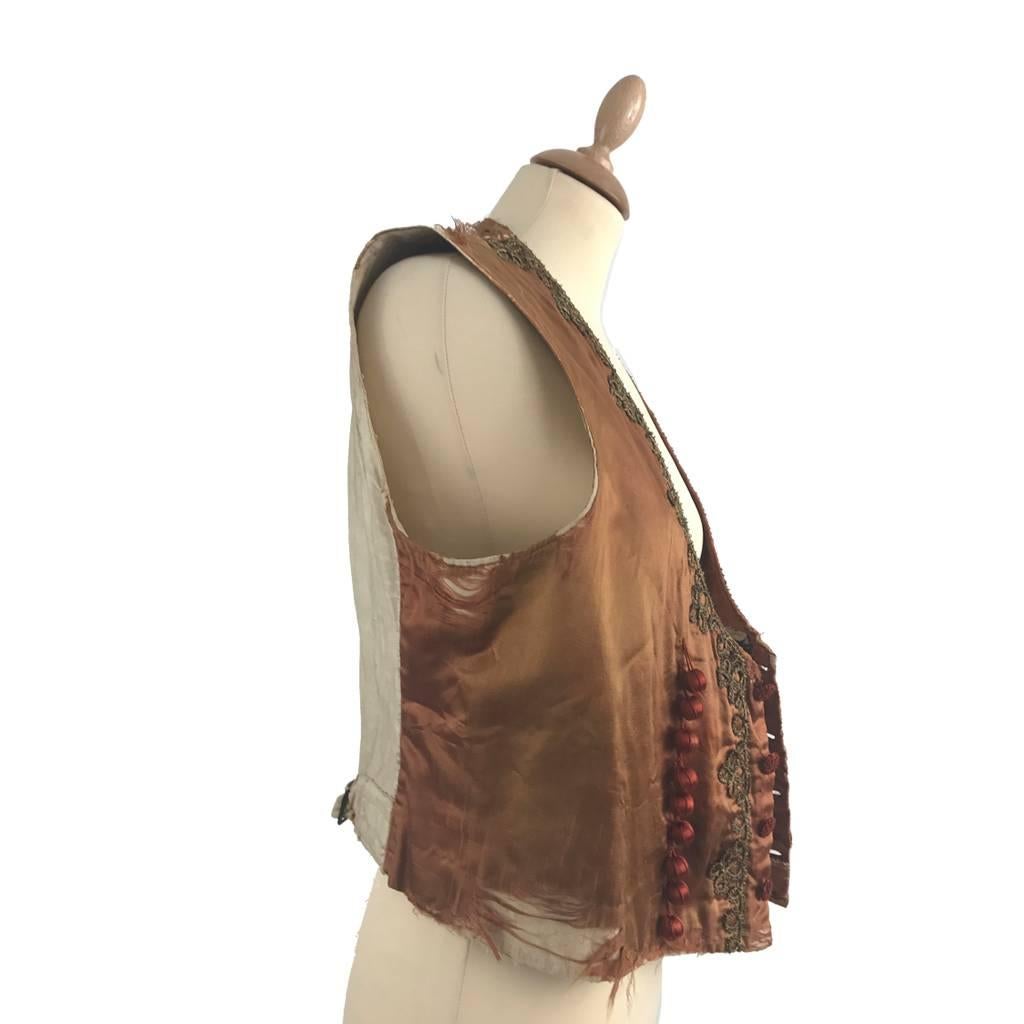 This wonderful waistcoat has been widely used and abused through its theatrical life! In the mid-1880s the newly introduced of U- or shield-shaped openings were favoured over the V shape partly because of their effectiveness at displaying the formal