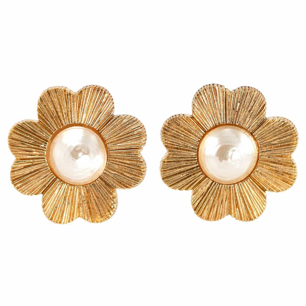 Exquisitely classic, these vintage oversized clip-on earrings by Yves Saint Laurent will never go out of fashion and are easy to combine with most outfits, casual or formal!
We Like! 
The gold plated textured metal Four Leaf Clover has a baroque