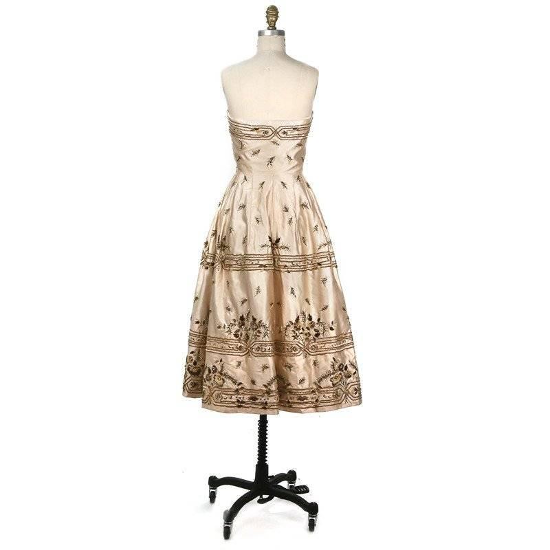 Jacques Fath Haute Couture Cocktail Dress, lavishly embroidered with bronze and gold on oyster hued silk satin from 1954. This Parisian Haute Couture piece is museum-worthy it's so gorgeous. 