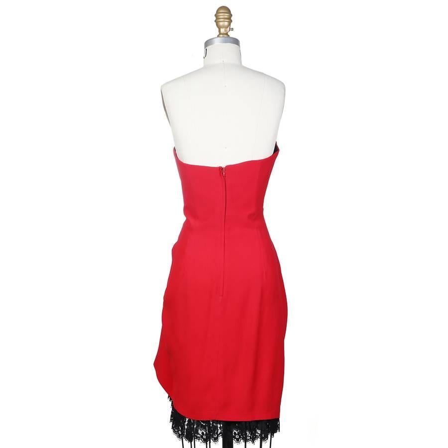 This is a red strapless cocktail dress by Moschino Couture! circa 1980s. It features a heart shaped bodice and gathered drape on left side waist with a black lace trim lining.  Hidden zipper in back. 