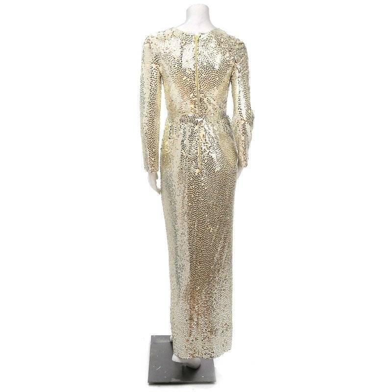 This is a long sleeve dress covered in a mixture of silver and bronze pailletes.  There is a 2