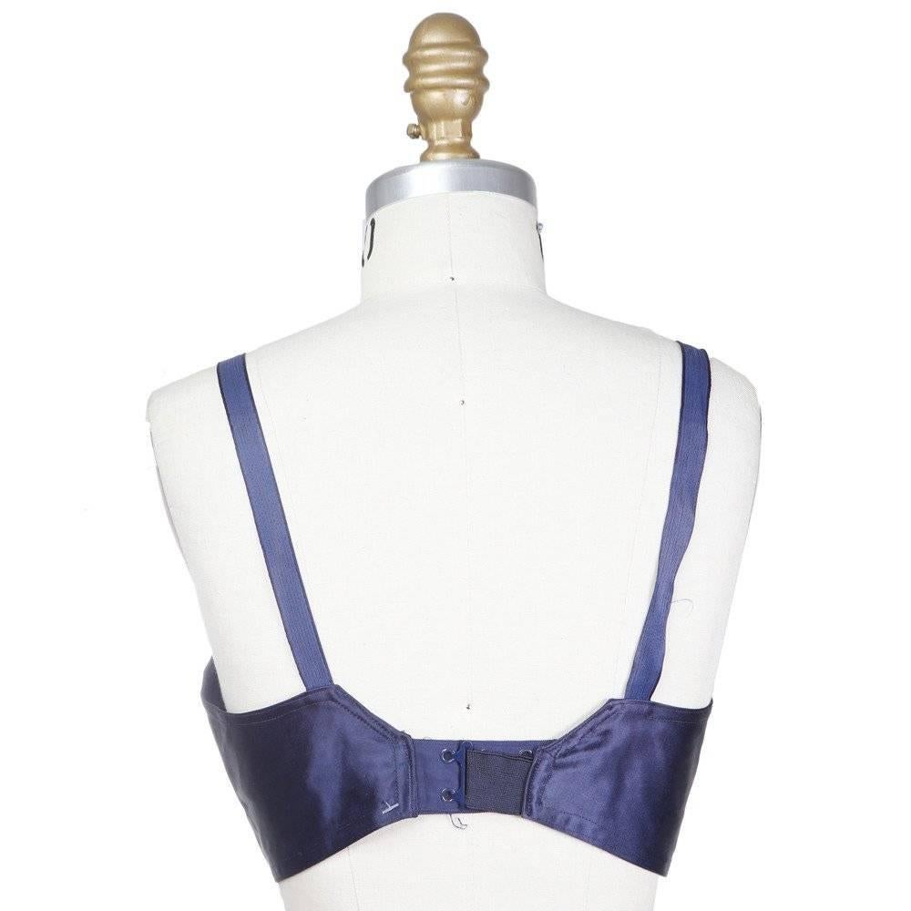 This is a Satin Bralette by Jean Paul Gaultier circa 1980s. Details include triangle under-bust darting, and elastic inserts at under-breast and around clasp. 