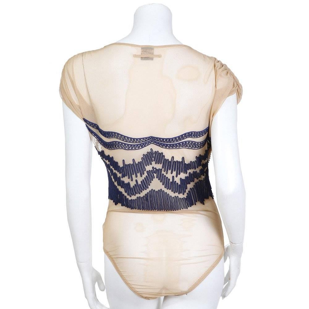 This is an Embroidered Mesh Bodysuit by Jean Paul Gaultier circa 1980s. Details include high scoop neck and cap sleeves. 