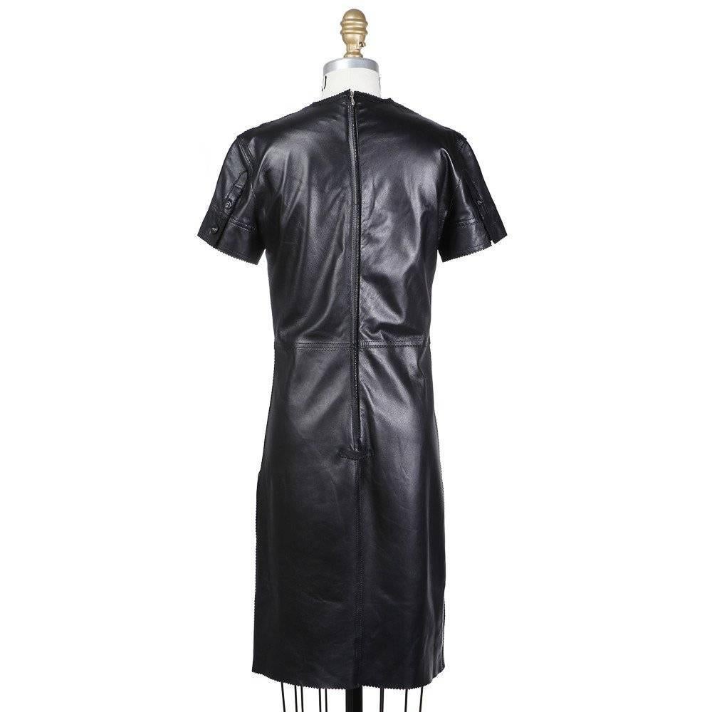 This is a Lace Up Leather Dress by Jean Paul Gaultier circa 1980s. Details include embroidered hip pockets. 