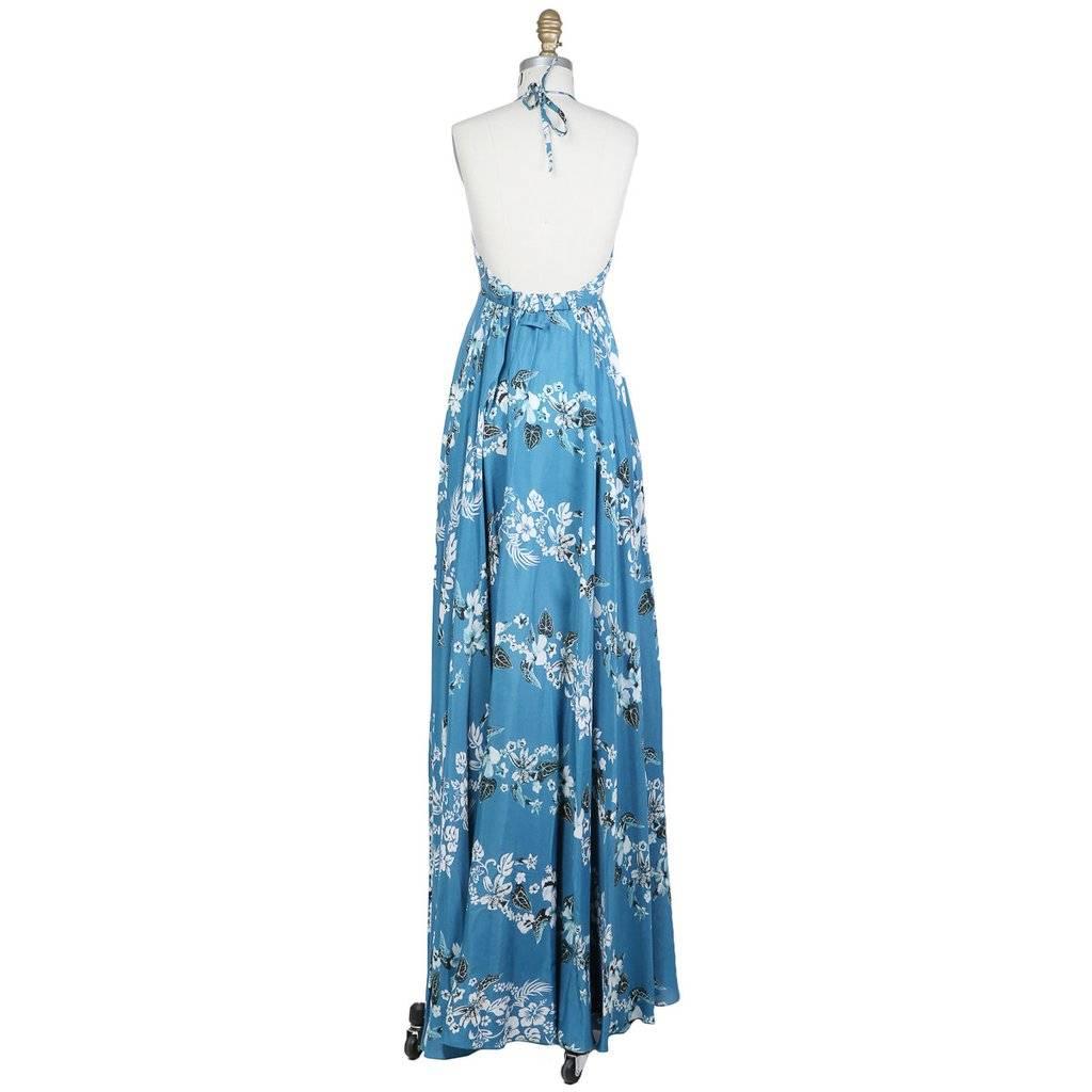 This is a Hawaiian Printed Tank Dress by Jean Paul Gaultier circa 1980s. Details include fitted bodice, huge flared skirt and hook-and-eye closure with elastic waist band in back. No materials listed - feels like silk/cotton/rayon blend. Made in