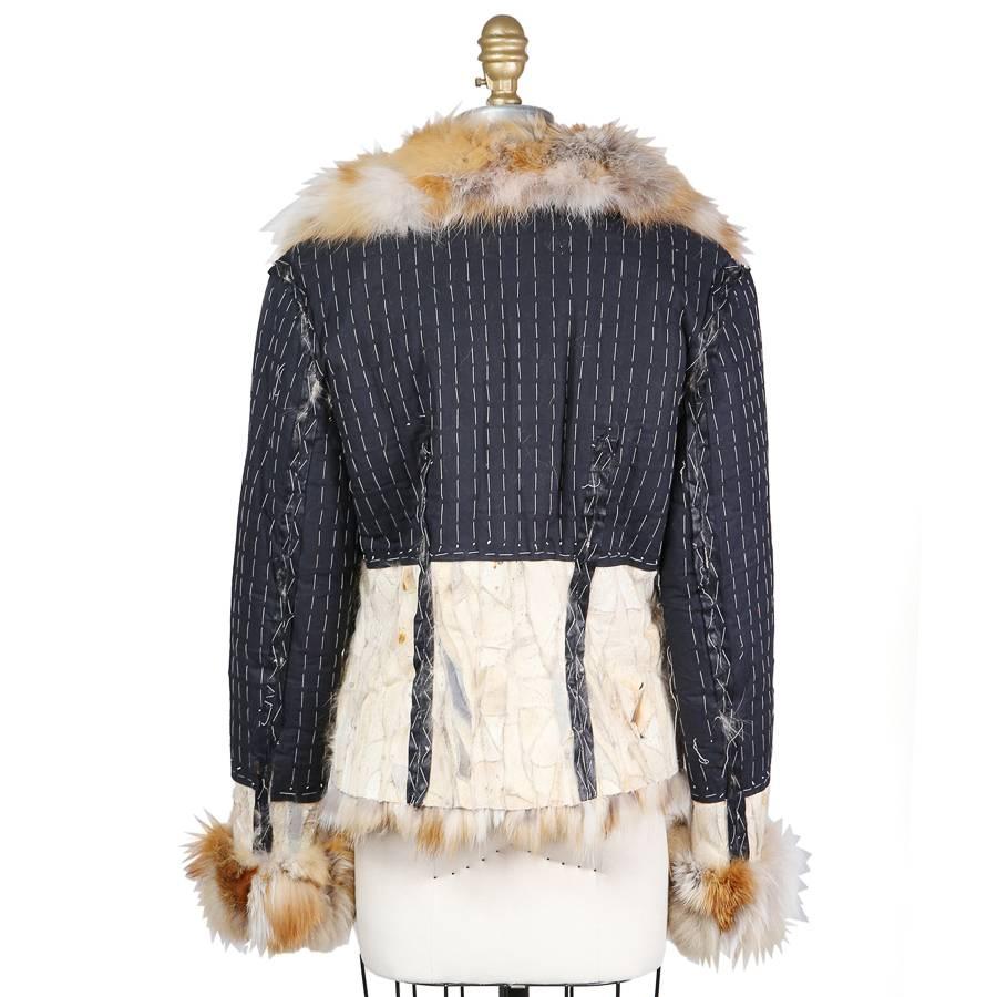This is a deconstructed jacket by John Galliano for Dior c. 2000s.  It's made from fox fur and cotton in a deconstructed inside-out design exposing the stitching, seam lines, and patchwork of suede and fur.  Details to note are the large fur collar