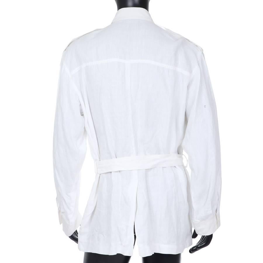 This is a white heavy linen shirt by Saint Laurent c. 1970s.  It features 4 front cargo style pockets, a belt, and 2 inner breast pockets.  
Shoulder to shoulder measurement is 21.5"
Sleeve length is 27"