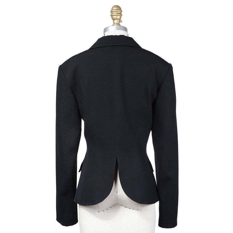 This is a black wool blazer by Azzedine Alaia c. 1980s.  It features two front waist pockets and a 5 button closure in front.  
Shoulder to shoulder measurement is 17"
Sleeve length is 23.5"