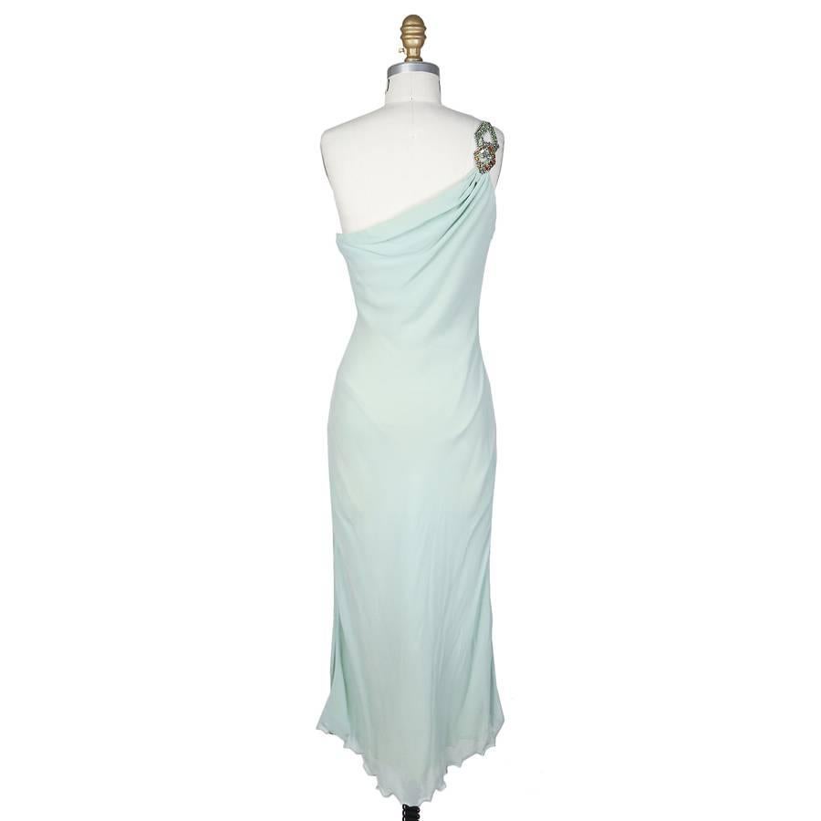 This is a mint green silk dress by Versace Atelier c. late 1980s.  It features a one shoulder embellished strap.  