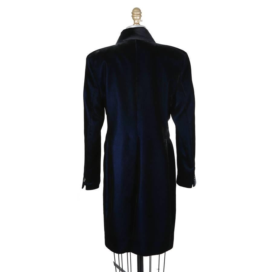 This is a blazer dress by Romeo Gigli from the 1980s.  It is made from a midnight blue velvet and is lined in satin.  It features a curved hem with a back slit and 3 button single breast closure.  Made in Italy.
Shoulder to shoulder is 17