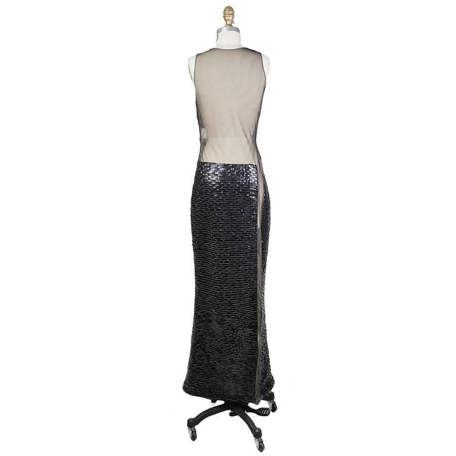 This is a sleeveless dress by CD Greene from recently.  It features lined mesh with panels of tiled leather pieces.  The closure is an invisible side zipper.  