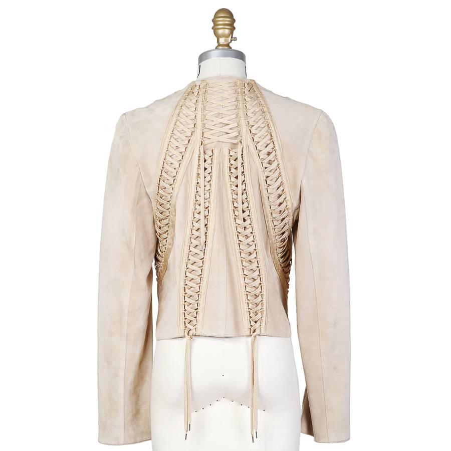 This is a beige suede jacket by John Galliano for Christian Dior c. late 1990s.  It features a shoestring lace up corset detail on the front and back.  Made in France.
Shoulder to shoulder is 15