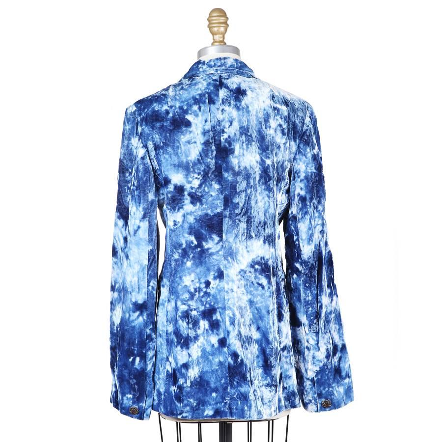 This is a velvet blazer by Todd Oldham from fall 1994.  It is made of a crushed blue velvet with a tie dye pattern.  It has a 4 button closure down the front as well as two front waist pockets.
15.5" shoulder to shoulder
24" long sleeves