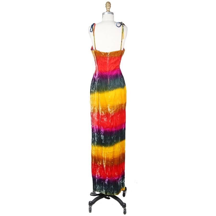 This is a maxi dress by Todd Oldham from .  It features spaghetti straps that tie on top of the shoulder and a 28" high side slit.  The closure is an invisible zipper down the back.