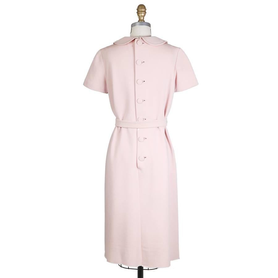 This is a shift dress by Norman Norell c. 1960s.  It features a rounded collar and includes a matching belt.  Satin lined in a matching color.

14.5