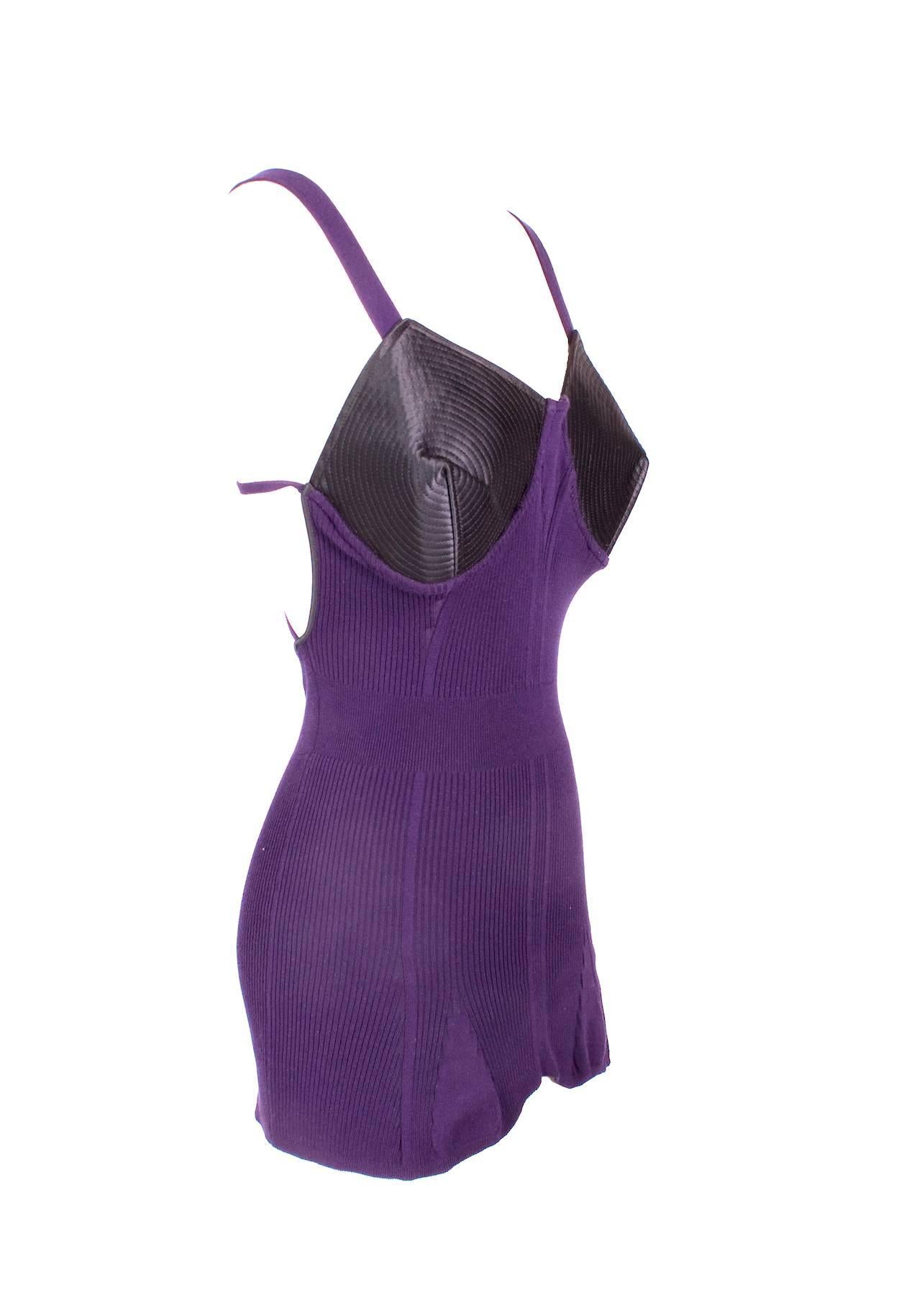 This is a purple tank top by Jean Paul Gaultier c. late 1980s/early 1990s.  It's made of a ribbed knit cotton with stretch and has built in cone bra cups.  