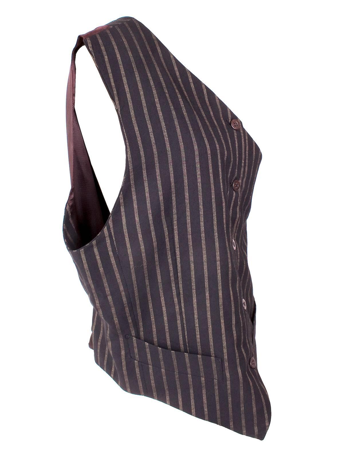 This is a front button vest by Jean Paul Gaultier circa late 1980s/early 1990s.  It features a single breast closure in front and a back cinch buckle.  

Armpit to armpit measurement is 19
