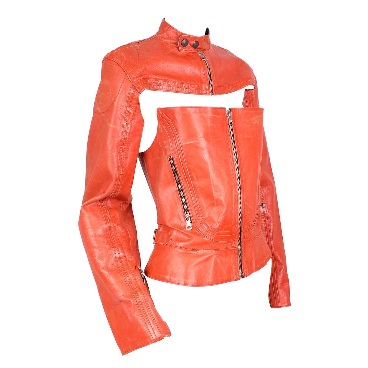 This is a leather corset and sleeves set by Jean Paul Gaultier c. 1990s.  It features a zipper down the front for both pieces and resembles a leather motorcycle jacket when worn together.  

Sleeves:
17