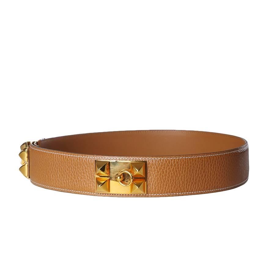 This is a natural colored togo leather belt by Hermes from 1995.  It features gold hardware with pyramid studs.  Adjustable waist of 27.5