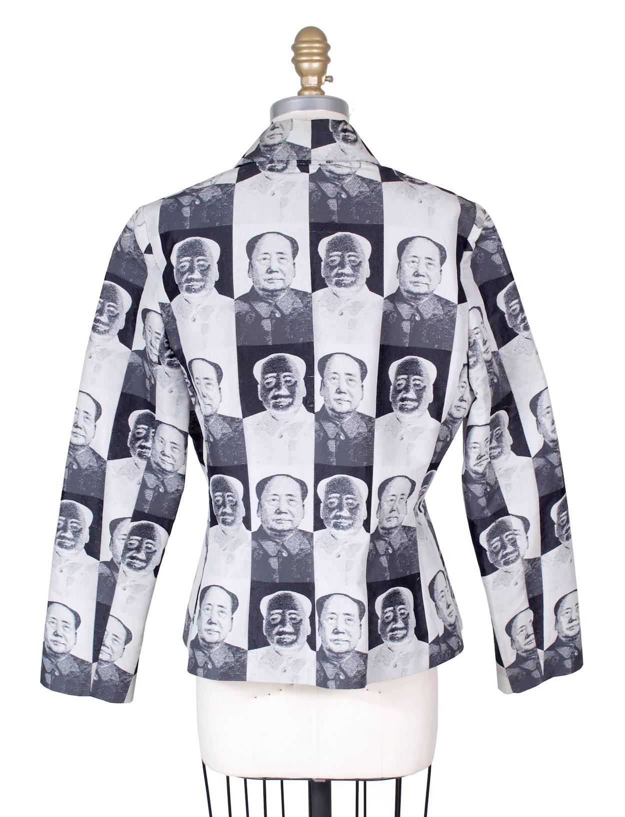 This is a jacket by Vivienne Tam from 1995.  It features a black and white pop art Mao print.  The shell is a water resistant polyester and is lined in satin.

15