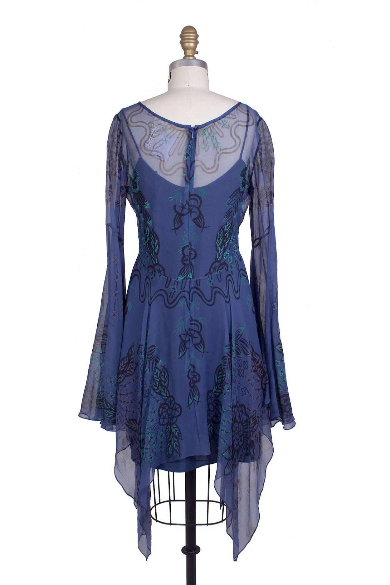 This is a sheer silk dress by Zandra Rhodes c. 1970s.  It features a floral print and bell sleeves.  Includes a separate slip.

15