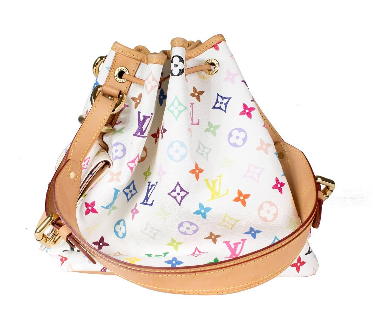This is a bucket bag by Louis Vuitton.  It's white leather with multicolor monogram.  The bag has two small side pockets with belt buckle closure.  It has a natural color leather shoulder strap that is adjustable to drop between 7.5