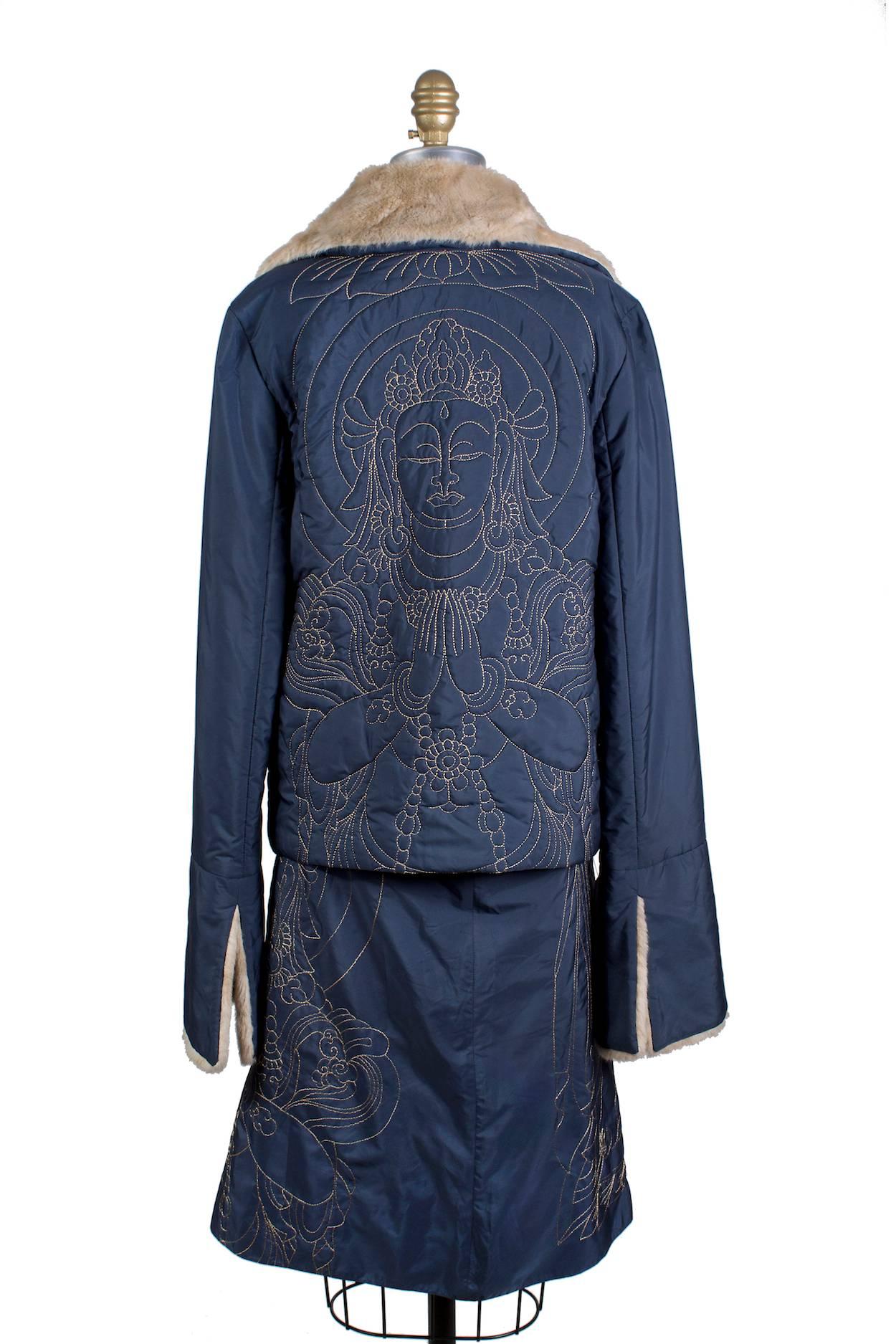 This is a skirt and jacket set by Vivienne Tam circa 1990s.  The jacket has a faux fur collar and cuffs and both pieces are embroidered to create a buddha motif.  Zipper closures for both pieces.

Skirt:
28