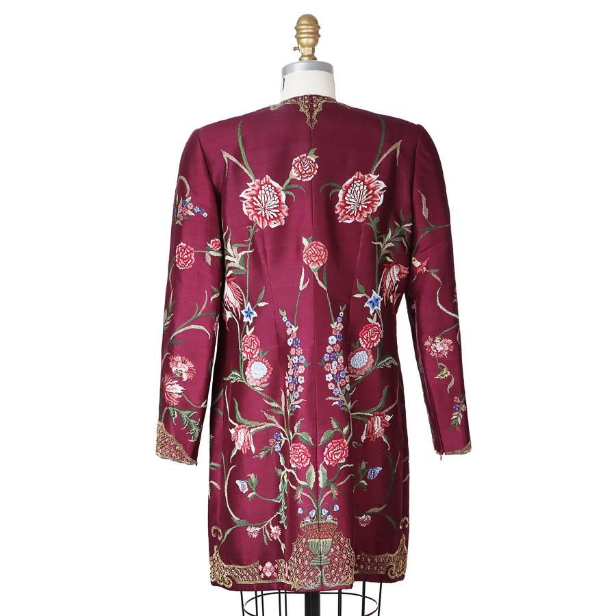 This is a jacket by Pierre Balmain c. 1960s.  It features a beaded and embroidered floral design on purple woven silk.  It is double lined and has a zipper closure in front with a top hook and eye closure.  Also has zippered cuffs.

15