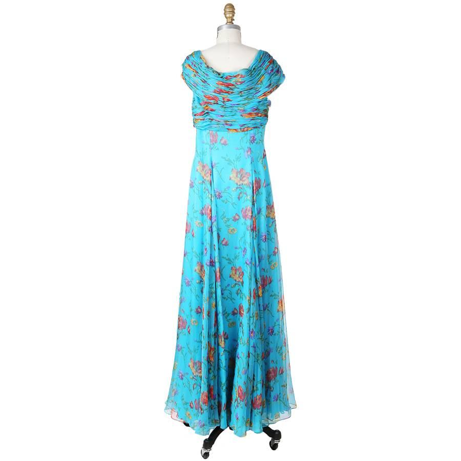 This is a dress by Oscar De La Renta featuring a ruched bust and an all over floral print.  The closure is a hidden side zipper closure.  Retail (tags still attached) was $6000.
